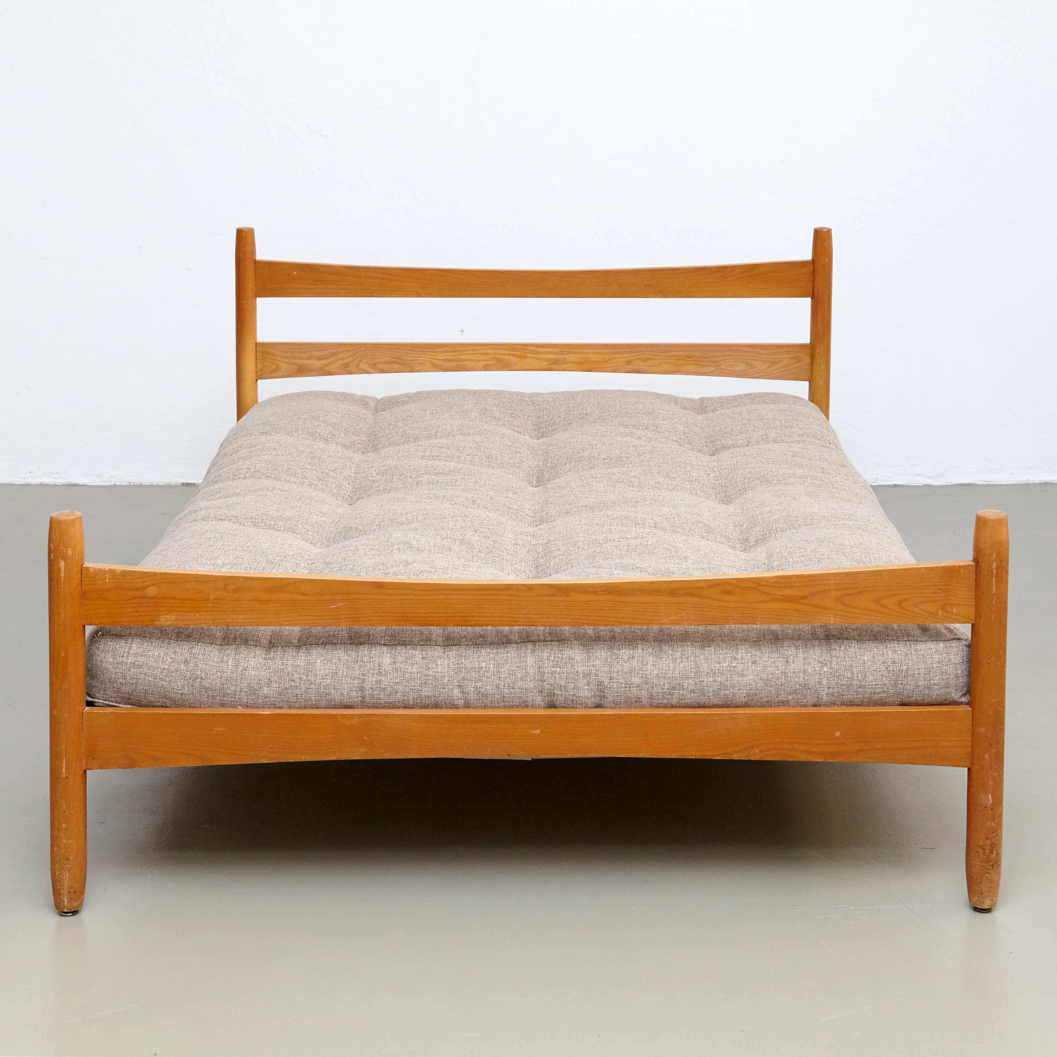 Bed designed by Charlotte Perriand for Meribel, circa 1960.
Manufactured in France.

Pinewood.

In good original condition, with minor wear consistent with age and use, preserving a beautiful patina.

Charlotte Perriand (1903-1999). She was