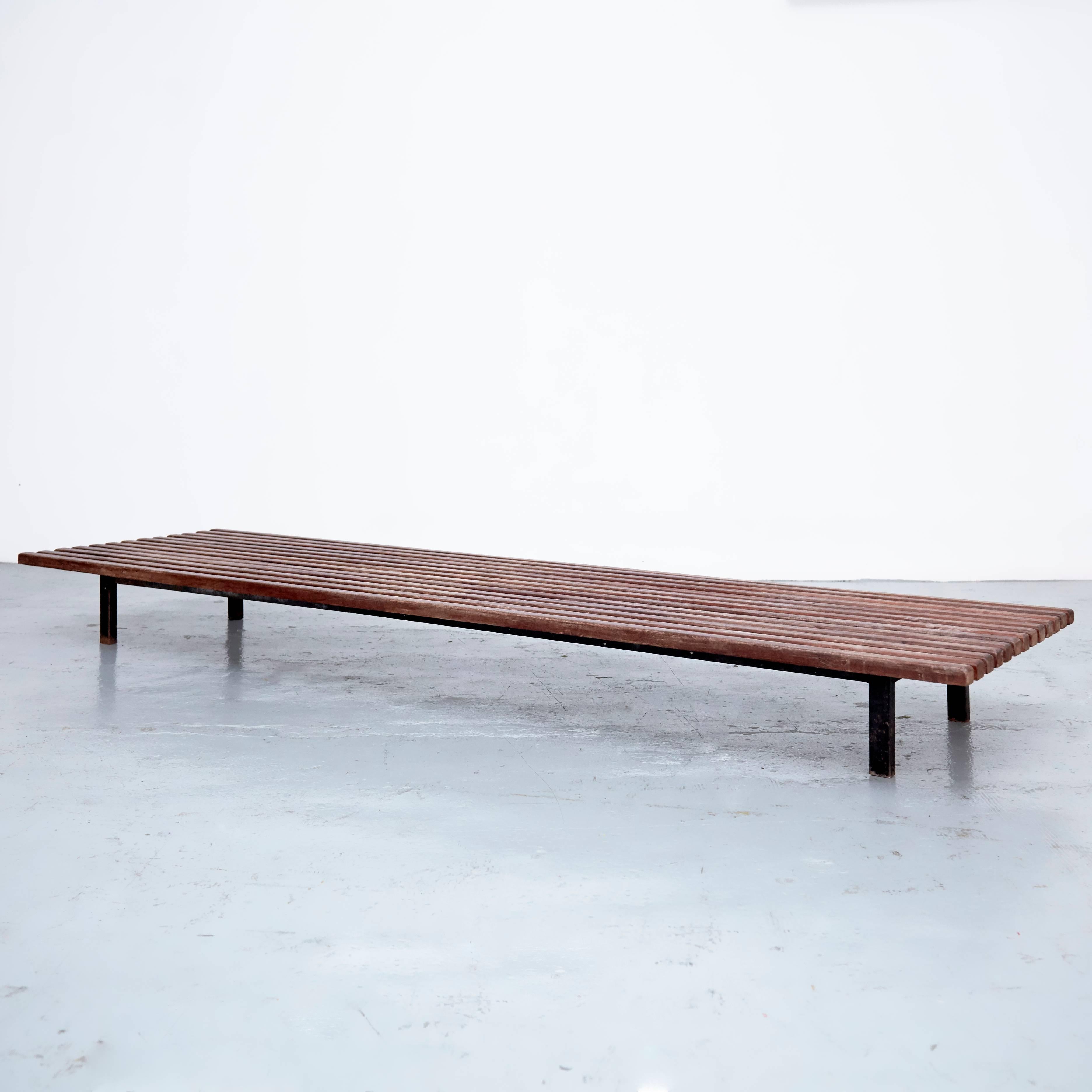Bench designed by Charlotte Perriand, circa 1950.
This model is with 13 slats of wood.
Edited by Steph Simon.

Wood, metal frame legs.

Provenance: Cansado, Mauritania (Africa).

In good original condition, with minor wear consistent with