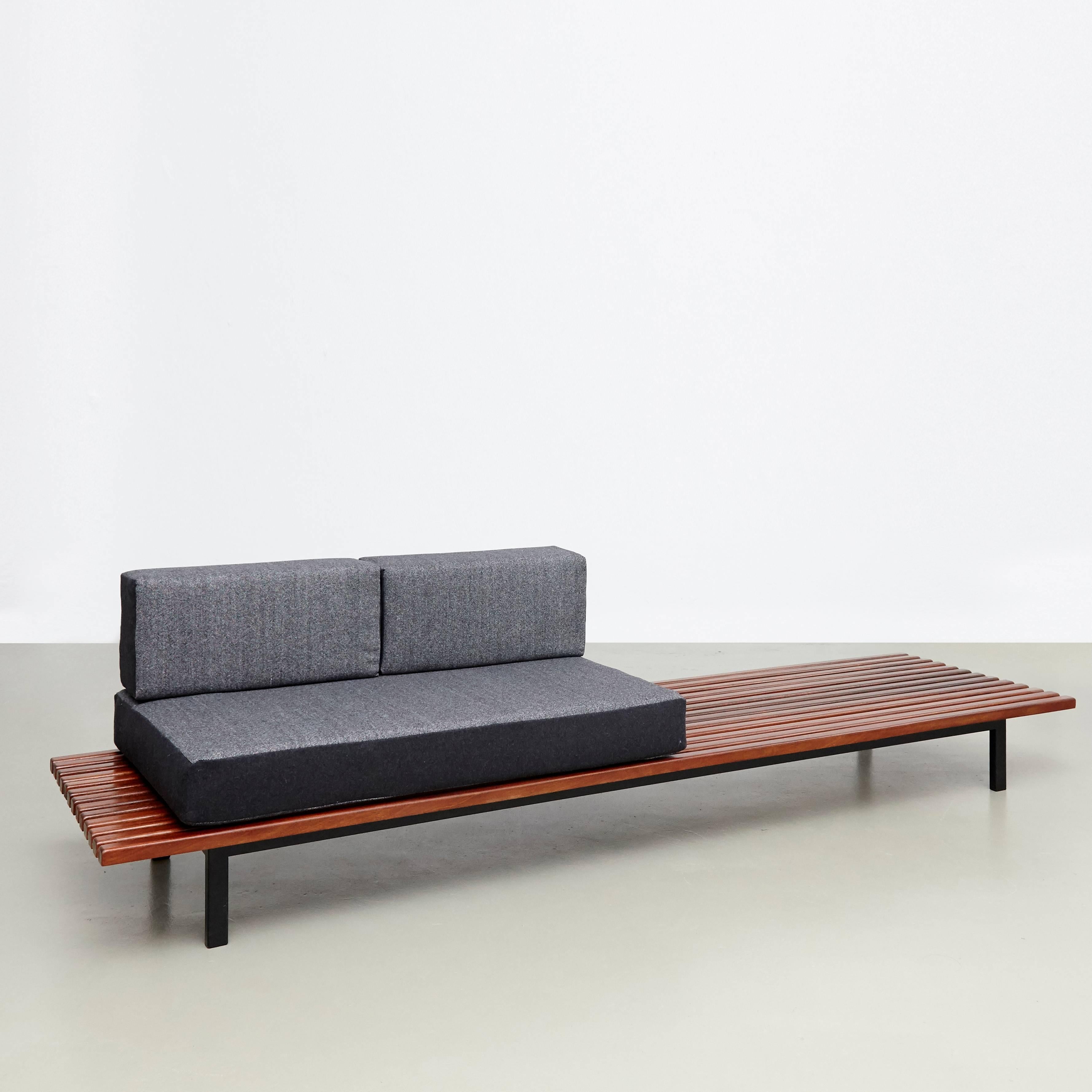 Bench designed by Charlotte Perriand, circa 1950.
Manufactured by Steph Simon (France), circa 1950.
Wood, lacquered metal frame and legs.

The cushions has been produced now according to the original measurements with high quality wool