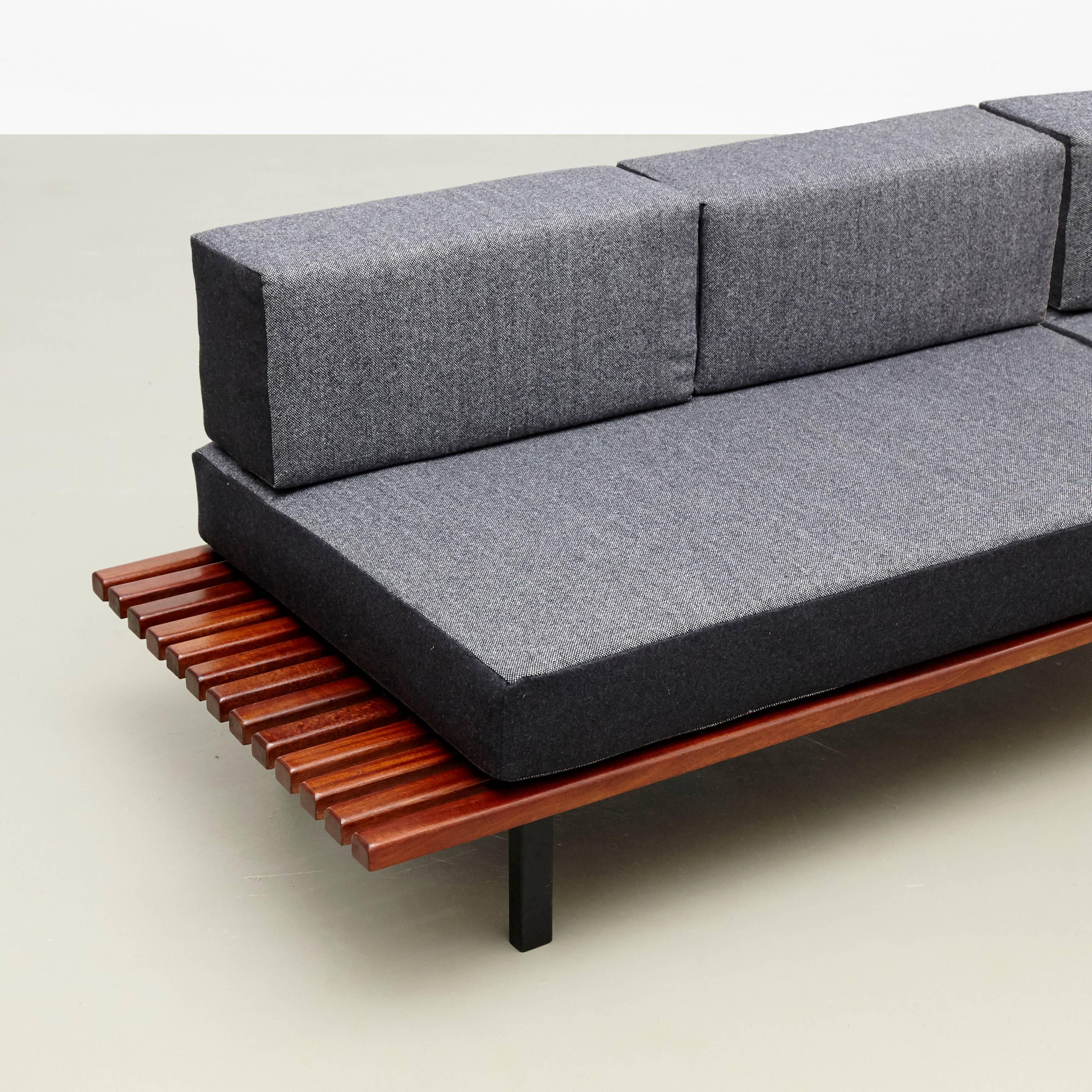 Bench designed by Charlotte Perriand, circa 1950.
Manufactured by Steph Simon (France) circa 1950.
Wood, lacquered metal frame and legs.

The cushions has been produced now according to the original measurements with high quality wool