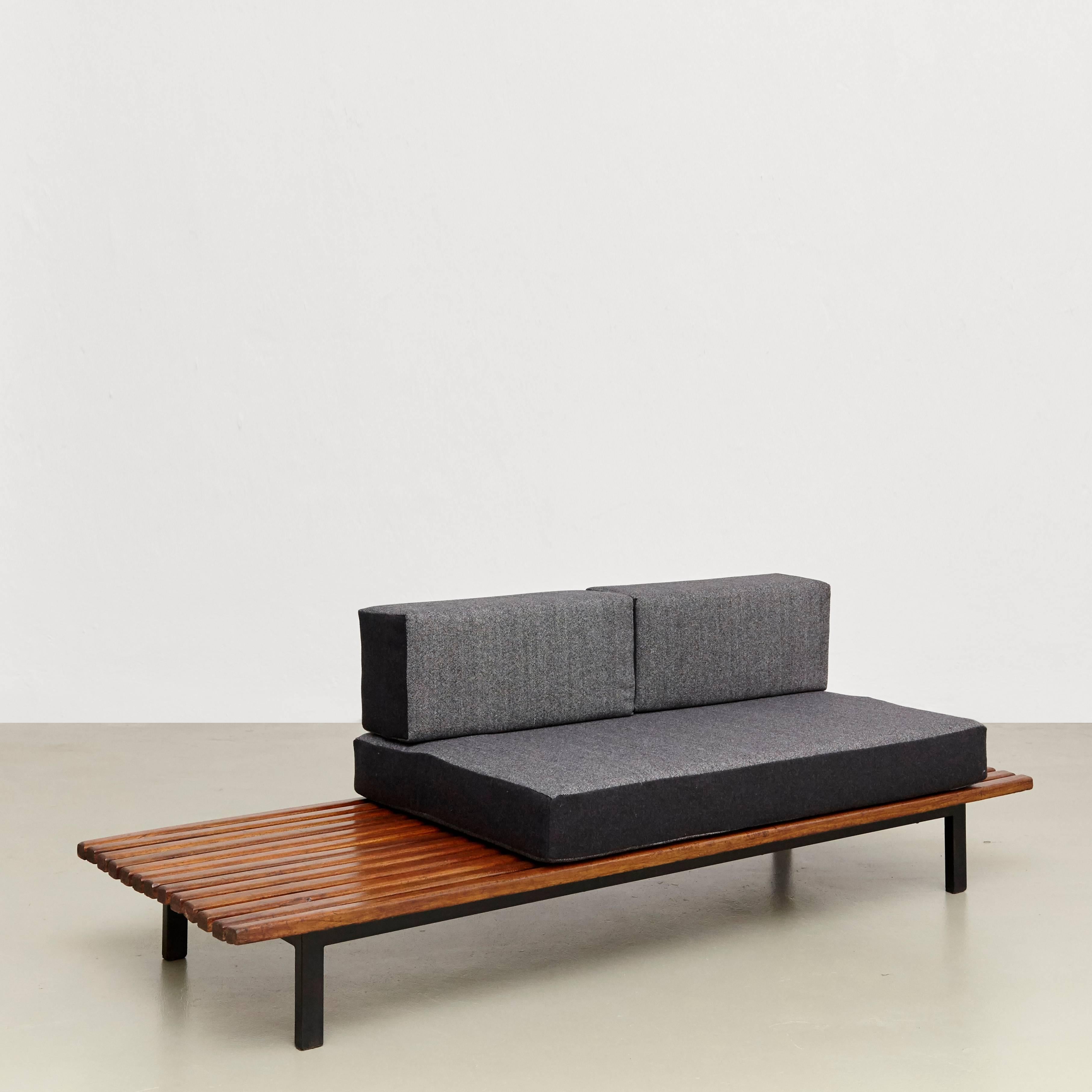 Bench designed by Charlotte Perriand, circa 1950.
Manufactured by Steph Simon (France) circa 1950.
Wood, lacquered metal frame and legs.

The cushions has been produced now according to the original measurements with high quality wool