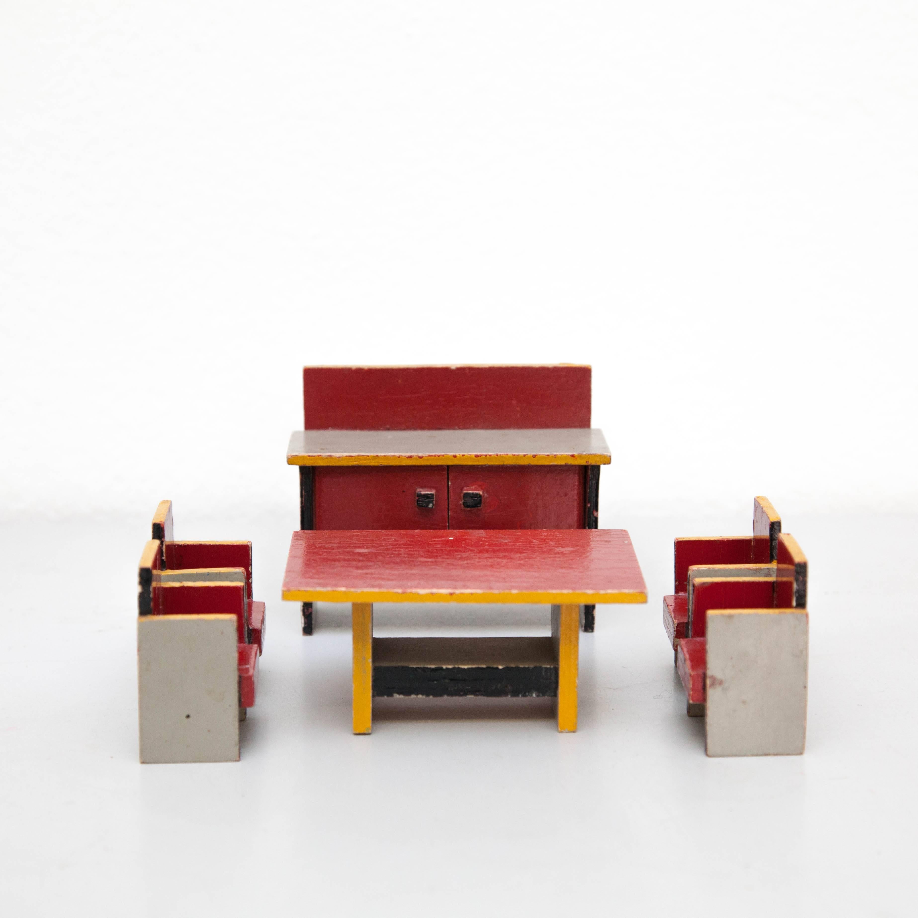 Toy designed by Ko Verzuu, circa 1940.
Manufactured by ADO in Netherlands.

Set of four painted wood chair, dining table and cabinet in the style of De Stijl.

In good original condition, with minor wear consistent with age and use, preserving