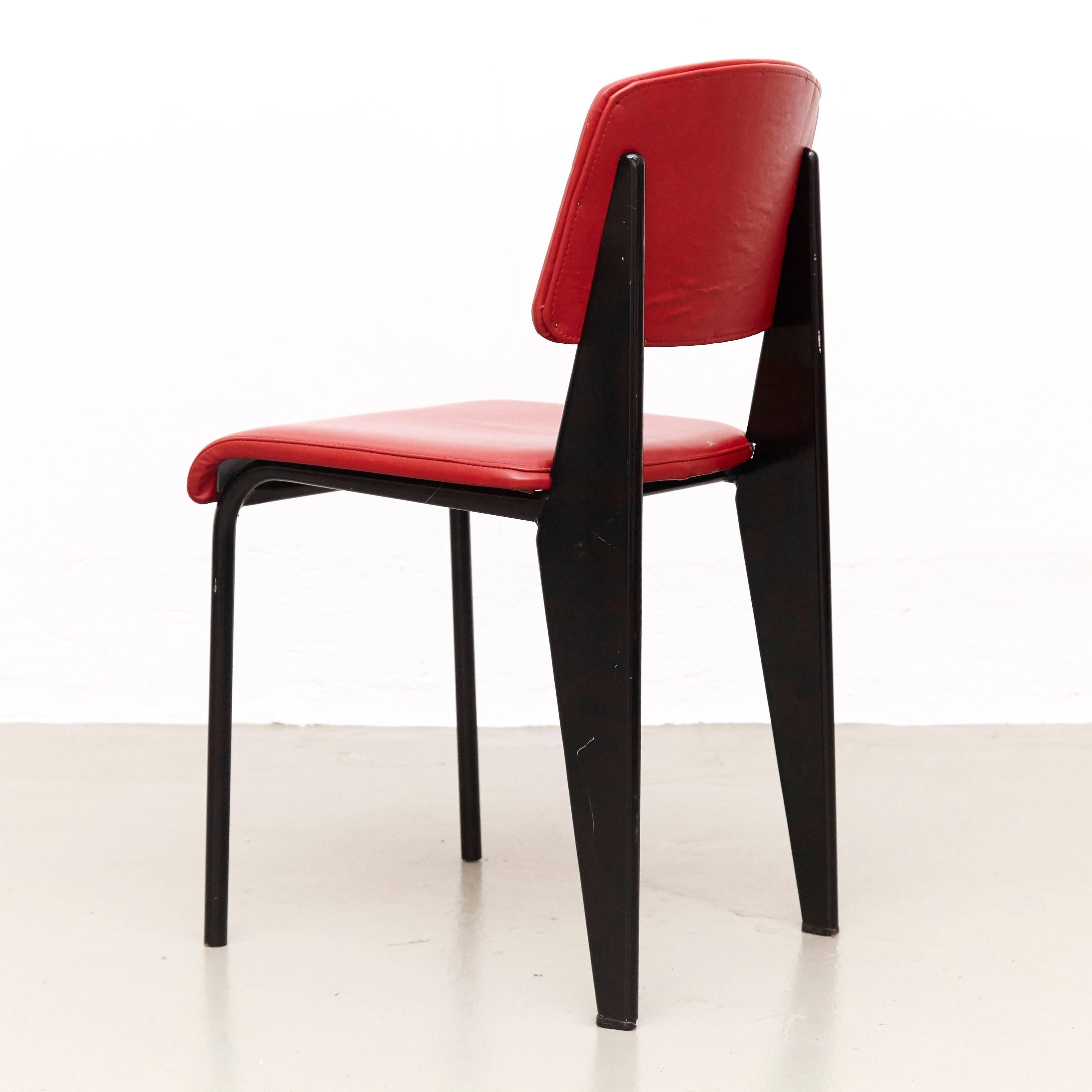Standard chair designed by Jean Prouvé.
Manufactured by Ateliers Prouve, France, circa 1950.
Model 305 in wood, upholstered in red many years ago by the previous owner.

The Standard chair was commissioned for the Social Security meeting rooms
