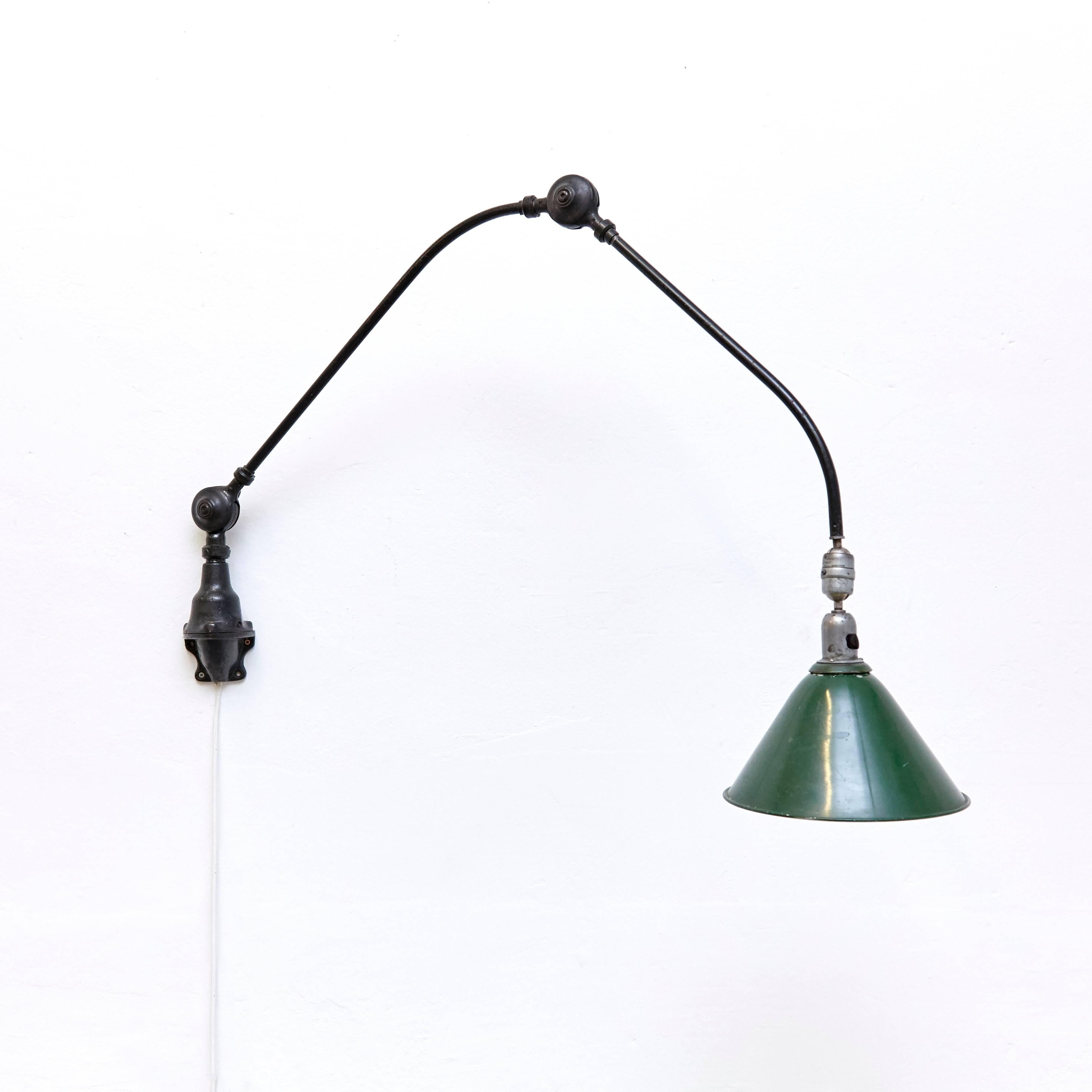 Wall lamp designed by Johan Petter Johansson.
Manufactured by Triplex (Sweden), circa 1930.
Aluminium and steel.

Measures: Height 94 x width 123 cm 26.5 diameter

In good original condition, with minor wear consistent with age and use,