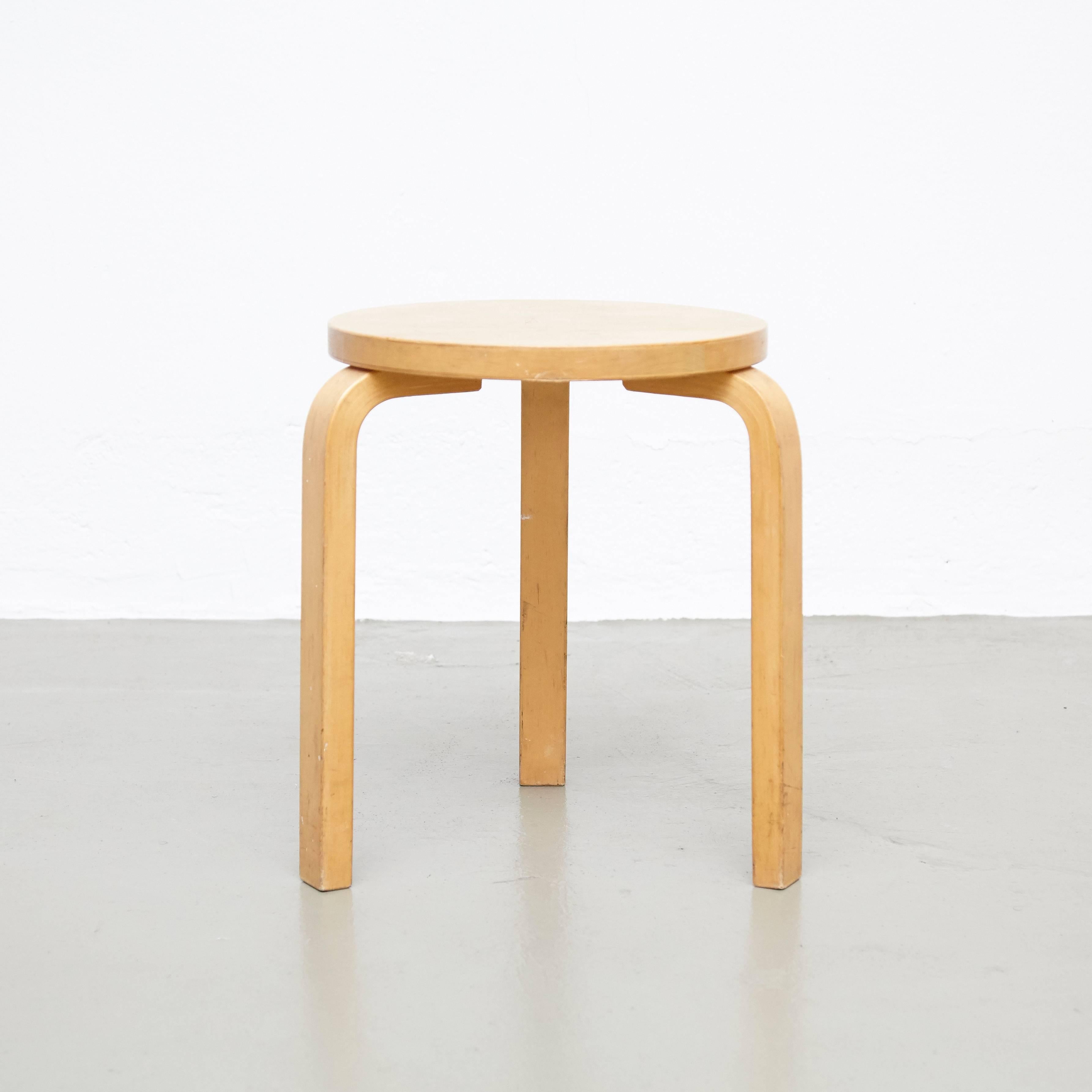 Stool designed by Alvar Aalto, circa 1960.
Manufactured by Artek (Finland).

Wood legs and structure.

In great original condition, with minor wear consistent with age and use, preserving a beautiful patina.

Hugo Alvar Henrik Aalto