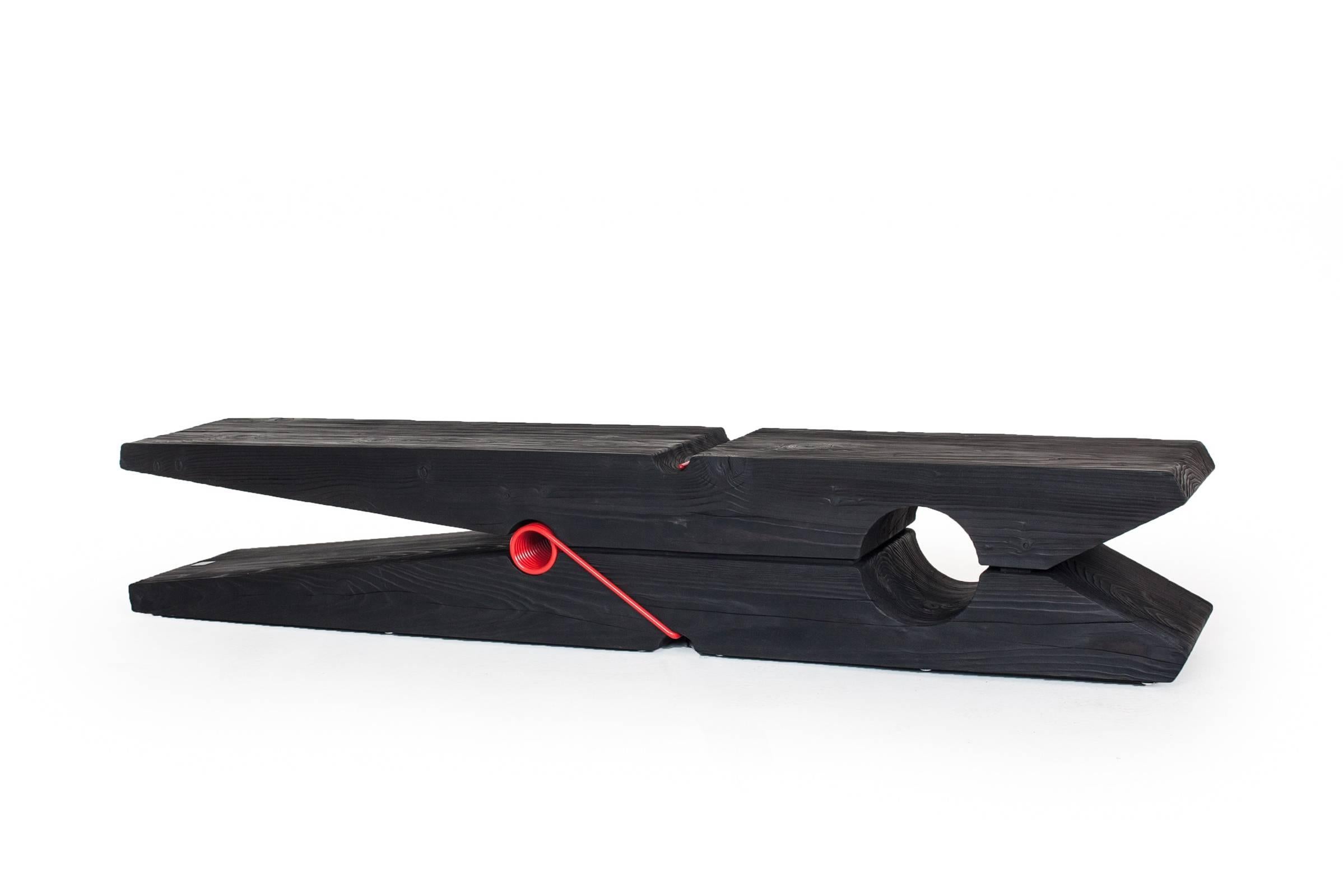 Bench Clothespin in solid natural black burnt cedar wood,
with red metal mechanism. Treated solid wood 
with wax with natural pine extracts.
L239,4xD45xH43cm, price: 10900,00€
L190xD45xH42cm, price: 9400,00€
L140xD39xH40cm, price: 8300,00€.
Solid