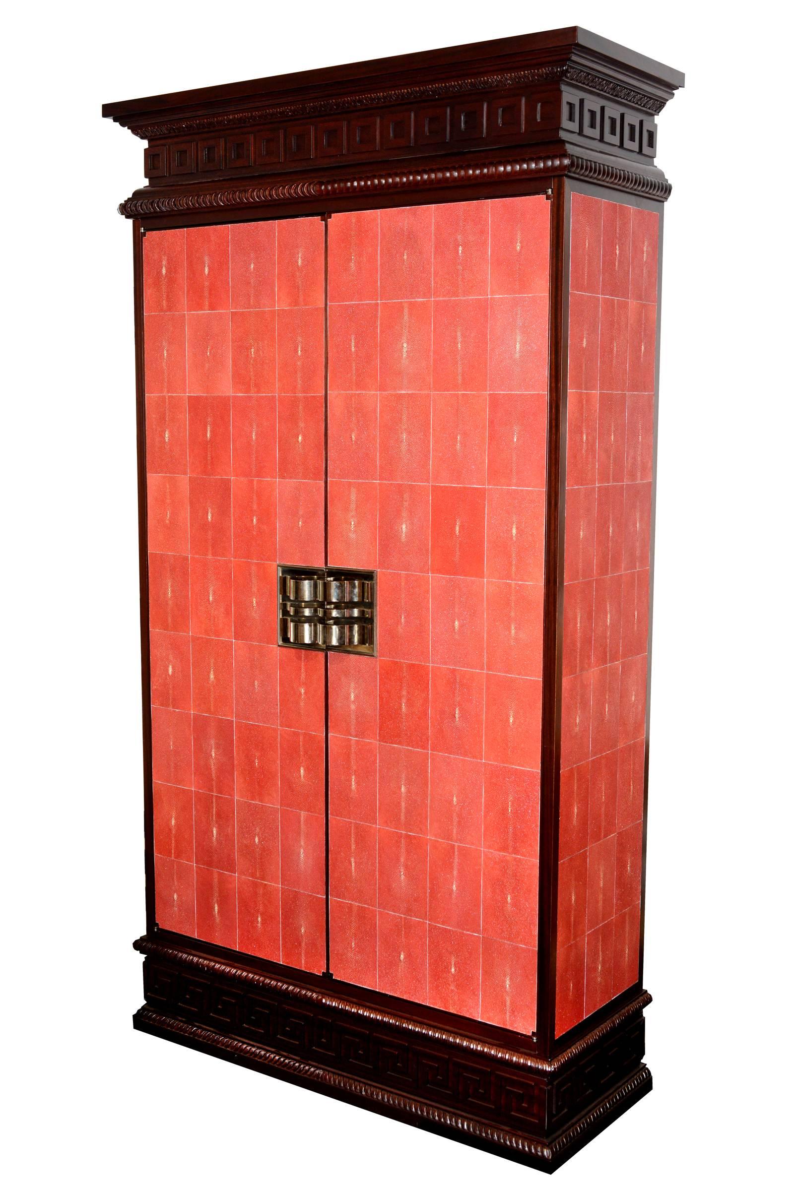Cabinet Galuchat rouge set of two in solid mahogany and red
genuine sharkskin, double handles nickel-plated copper,
with interior shelves with central cushion in fabric and 
interior lights. Exceptional piece.
Set of two cabinets available. Unit