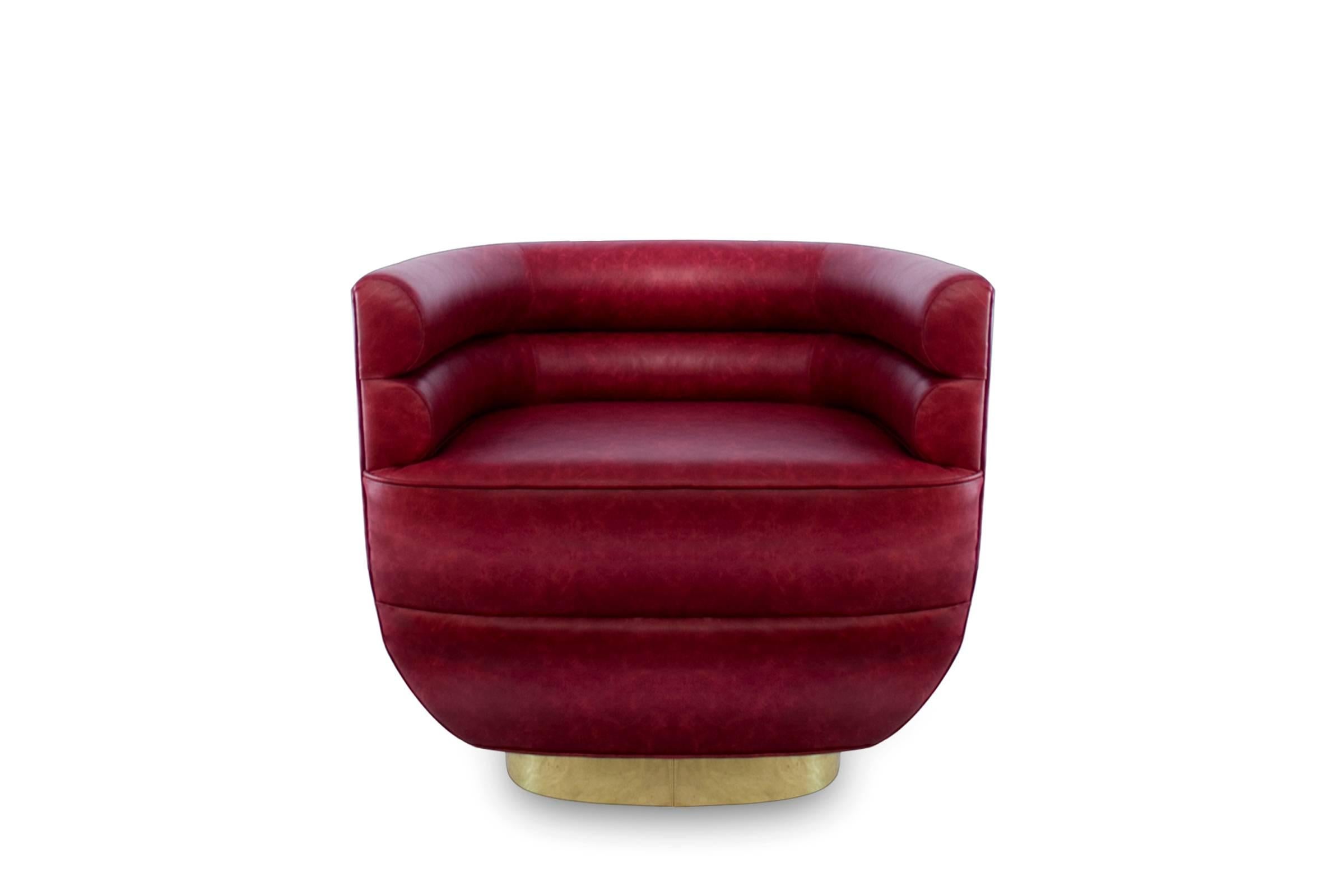 Armchair color lounge with solid wood
structure, upholstered and covered with 
genuine red leather and on swivel polished 
brass base. Also available in green, purple
or brown leather.
