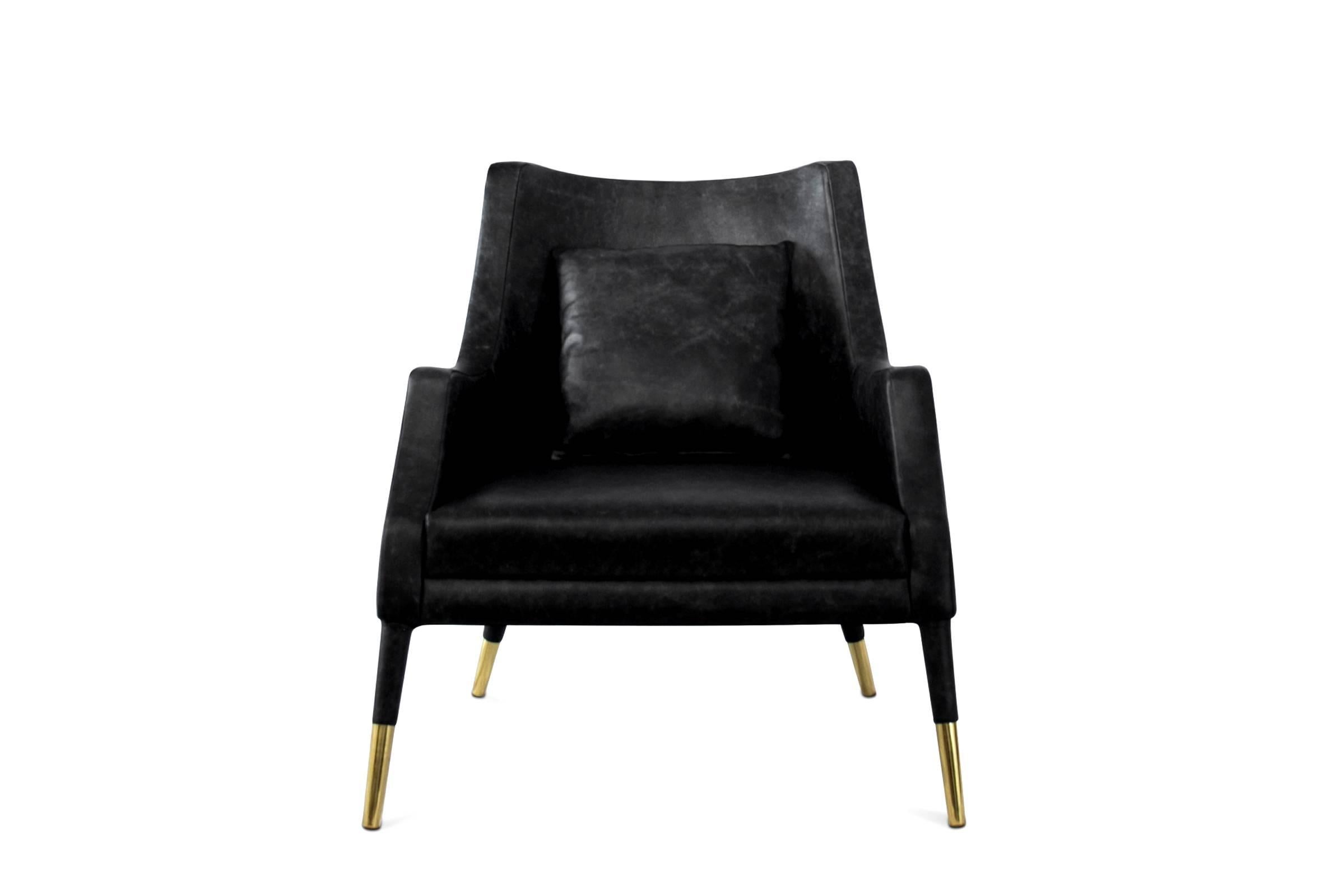 Armchair black lounge with wood structure, upholstered
and covered with black genuine matte leather Grade A.
With in solid brass in polished finish. Cushion included. 

