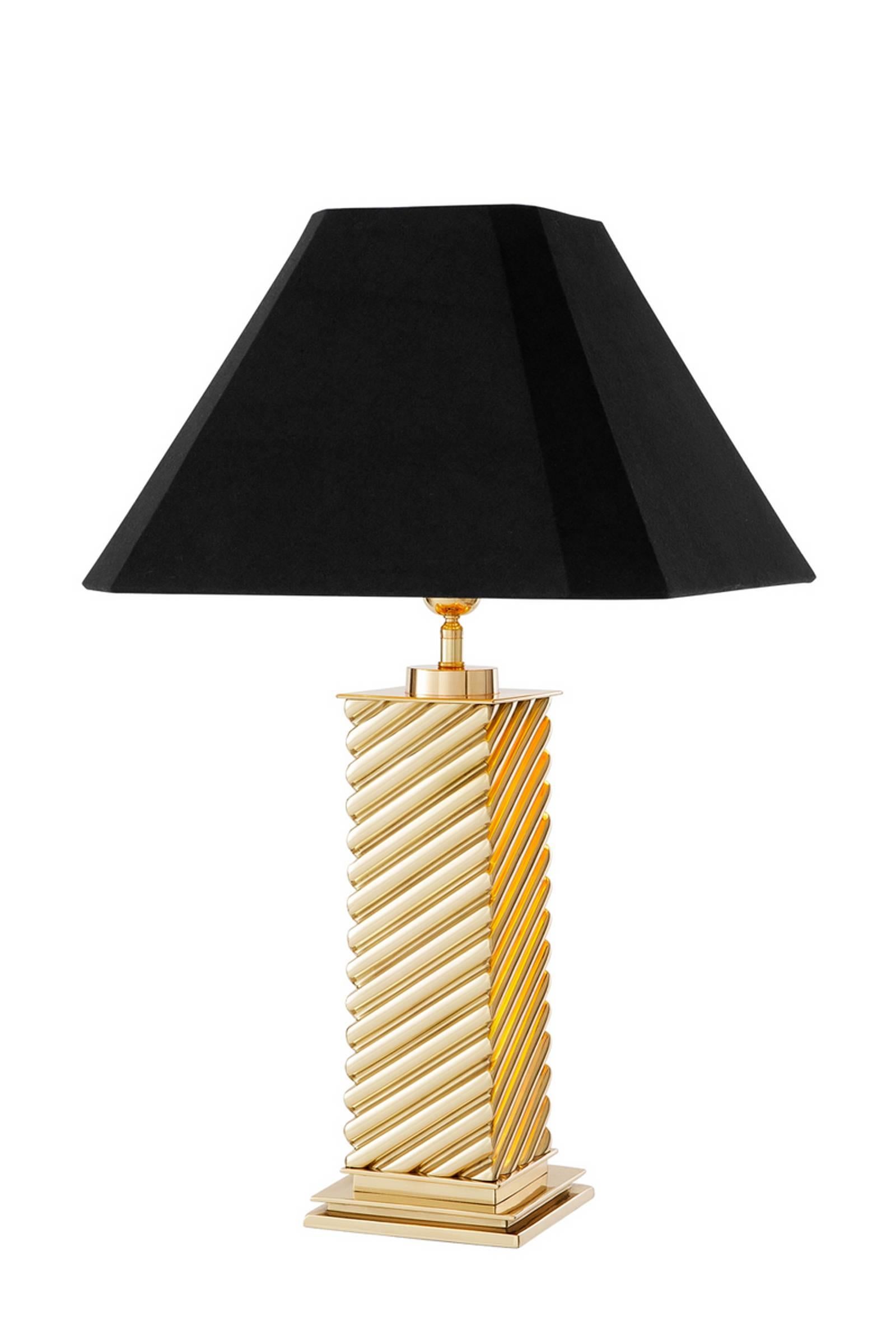 Table lamp column in polished brass with black 
shade. Available in antique bronze finish.
