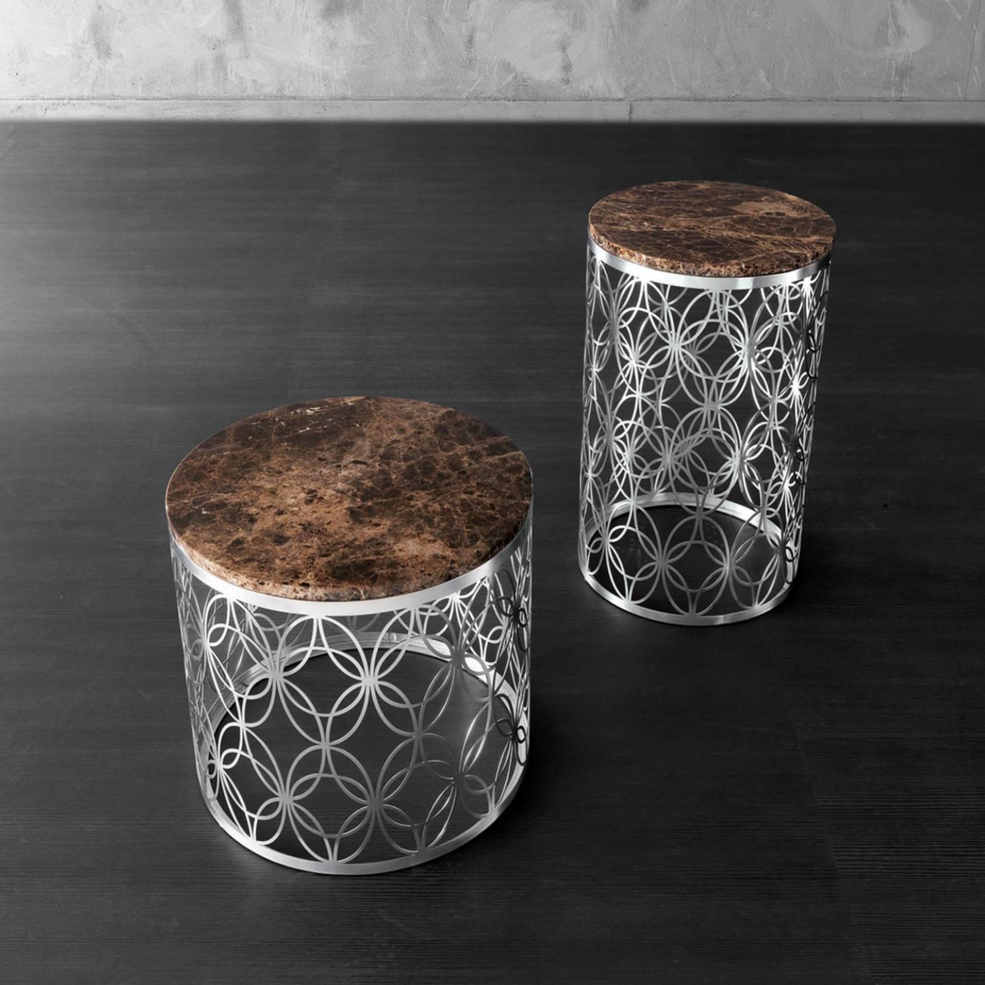 Side table Arnold with handcrafted stainless
steel structure and marble top. Available with
black glass top or white glass, price: 2900,00€.
Also available in Ø 40 x H 65 cm, price 3360,00€ or
with black glass top or with white glass top,
price: