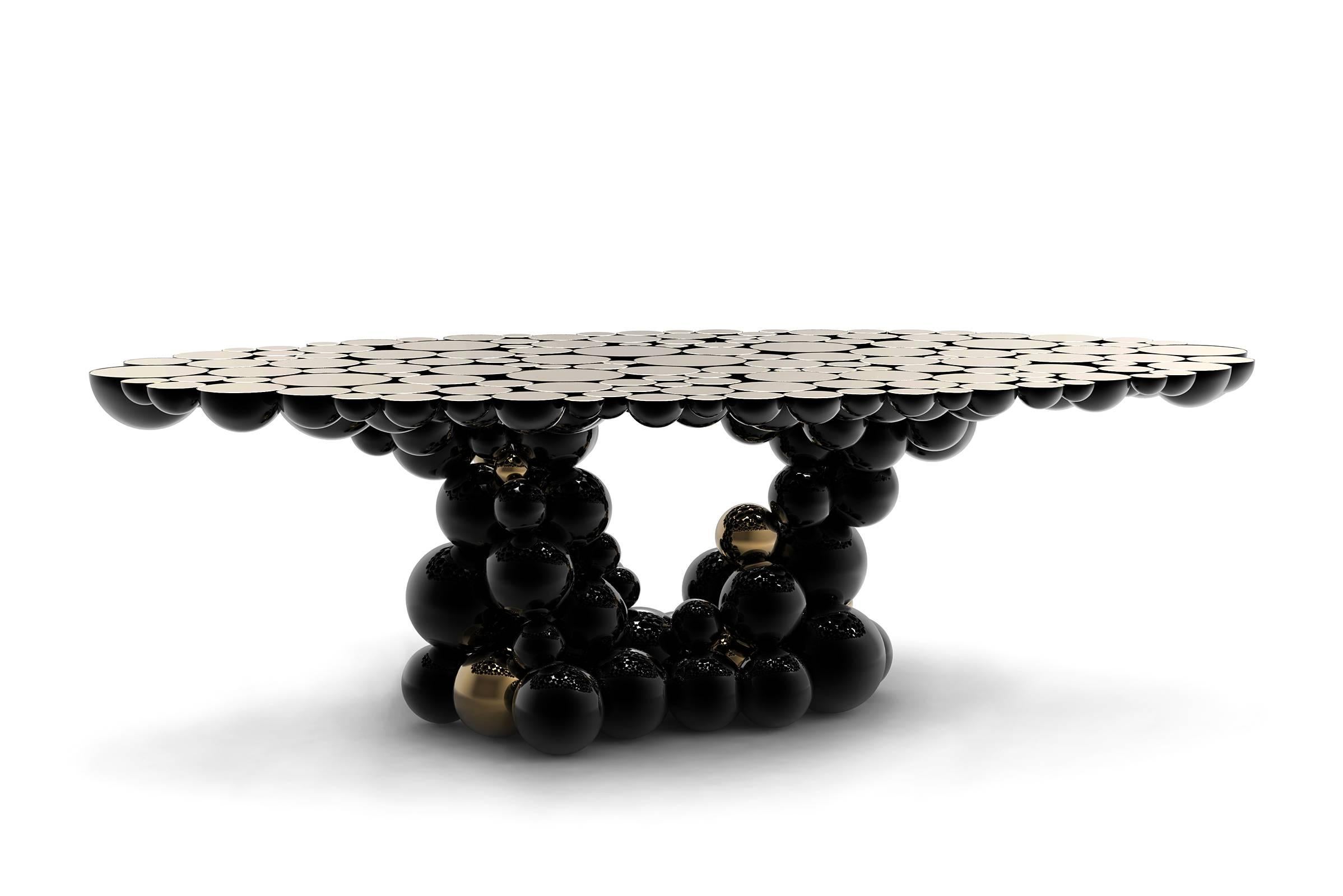 Dining table or conference table spheres composed by 
metallic spheres and semi spheres joined together. 
Aluminium black and gold finish. Exceptional piece.
Available in console and side table.
