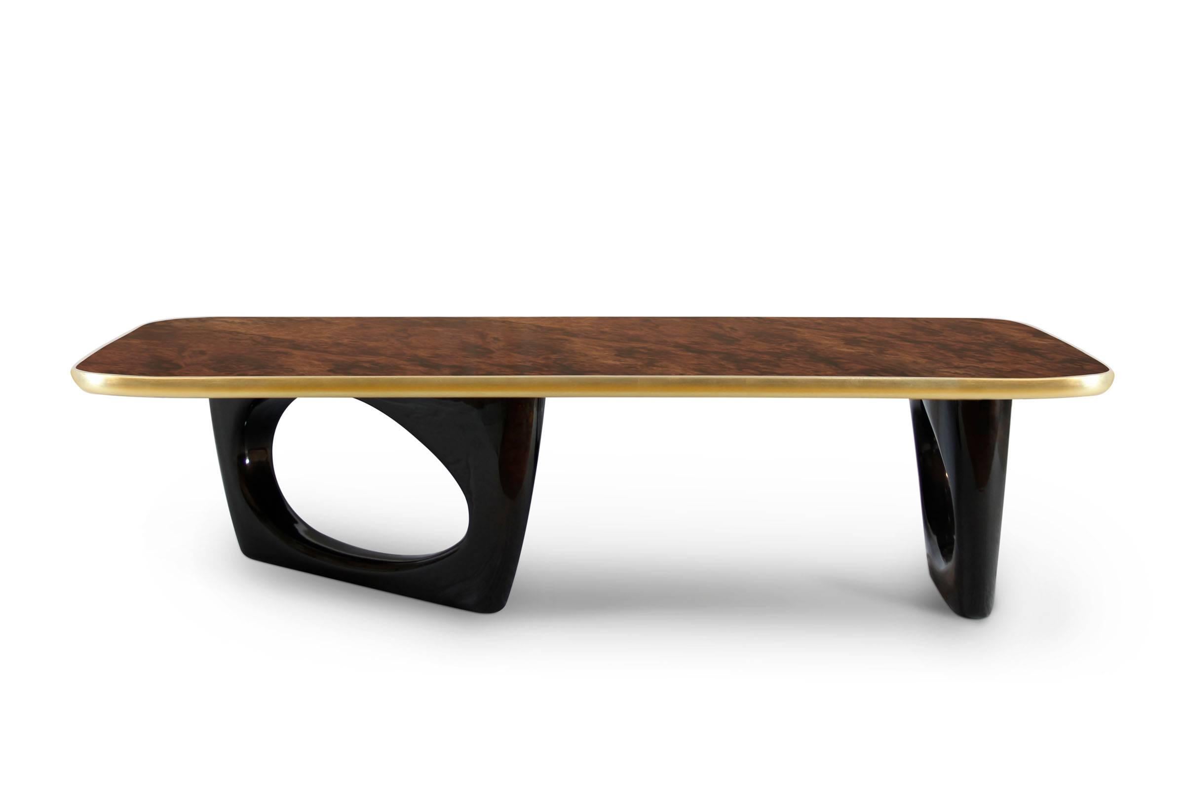 Coffee table gold walnut root with solid walnut top
with a gold leaf frame and black varnished walnut wood base.
