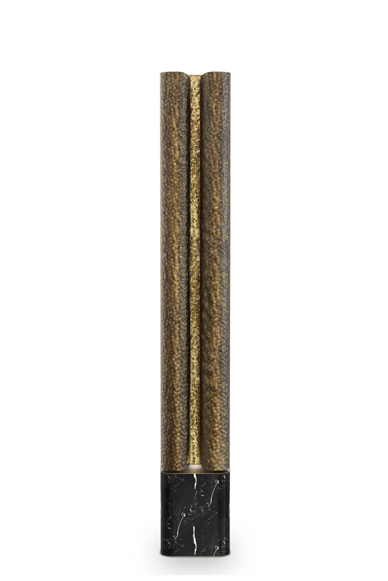 Floor lamp Tuba with handcrafted hammered aged
brush brass. Polished brass inside. Base in Nero 
Marquina marble. 