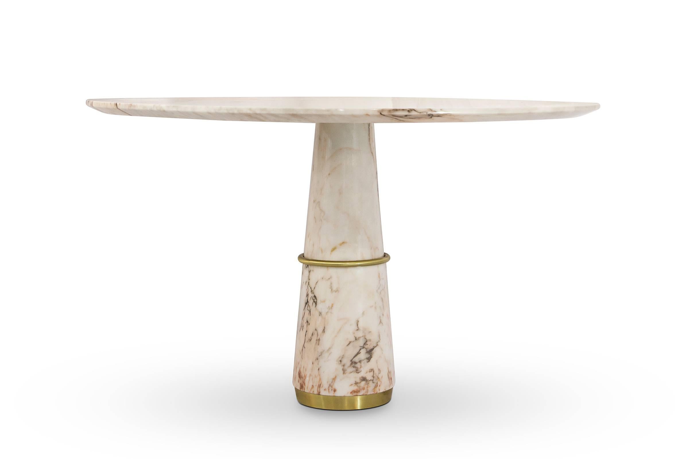 Dining table TAMA white marble base and 
white marble top. Details in polished vintage brass.
