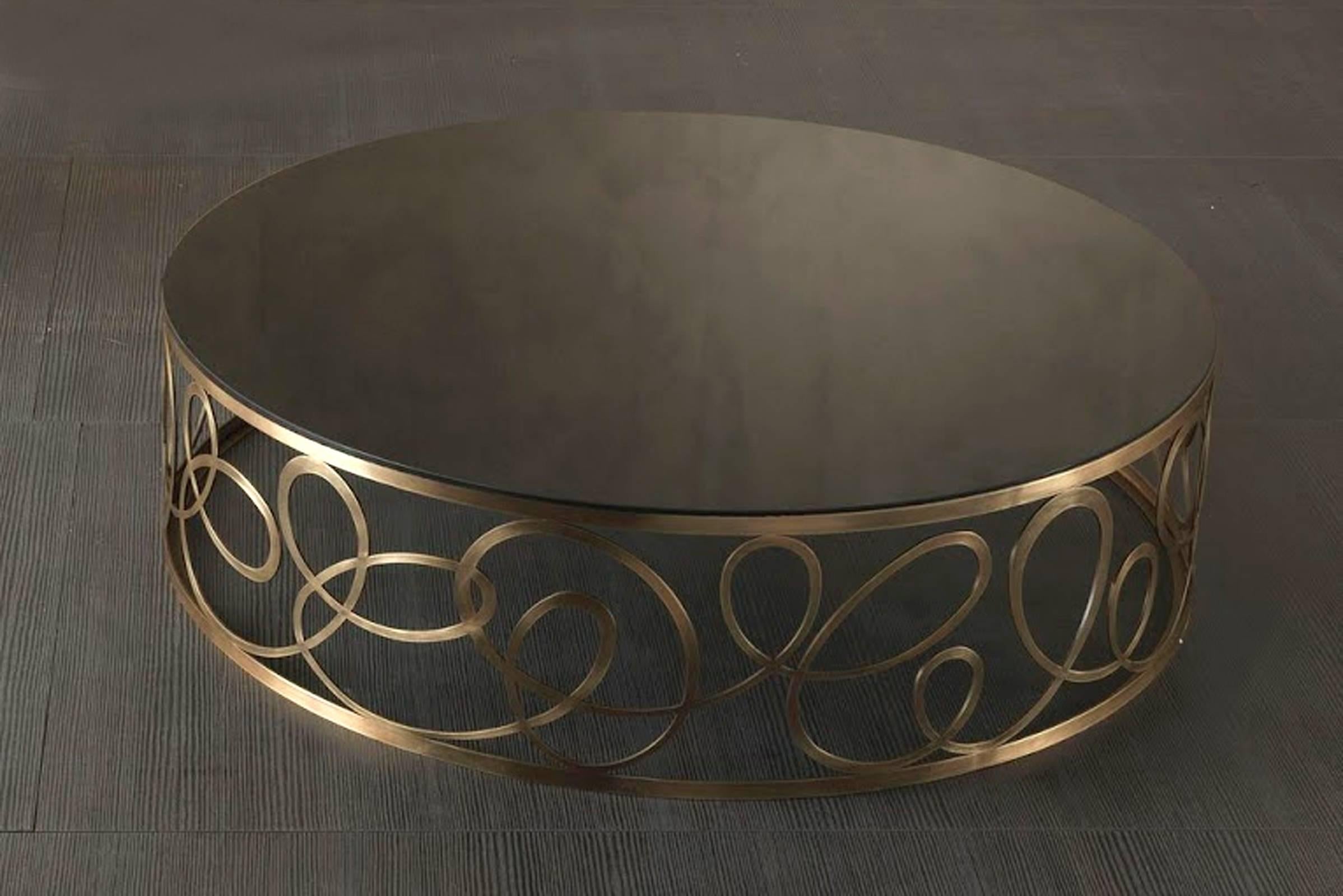 Round coffee table curving with bronze base 
and black glass top top. 
Also available with leather top, price: 10900,00€
Table also available in diam Ø110cm or custom made side table,
on request.

 