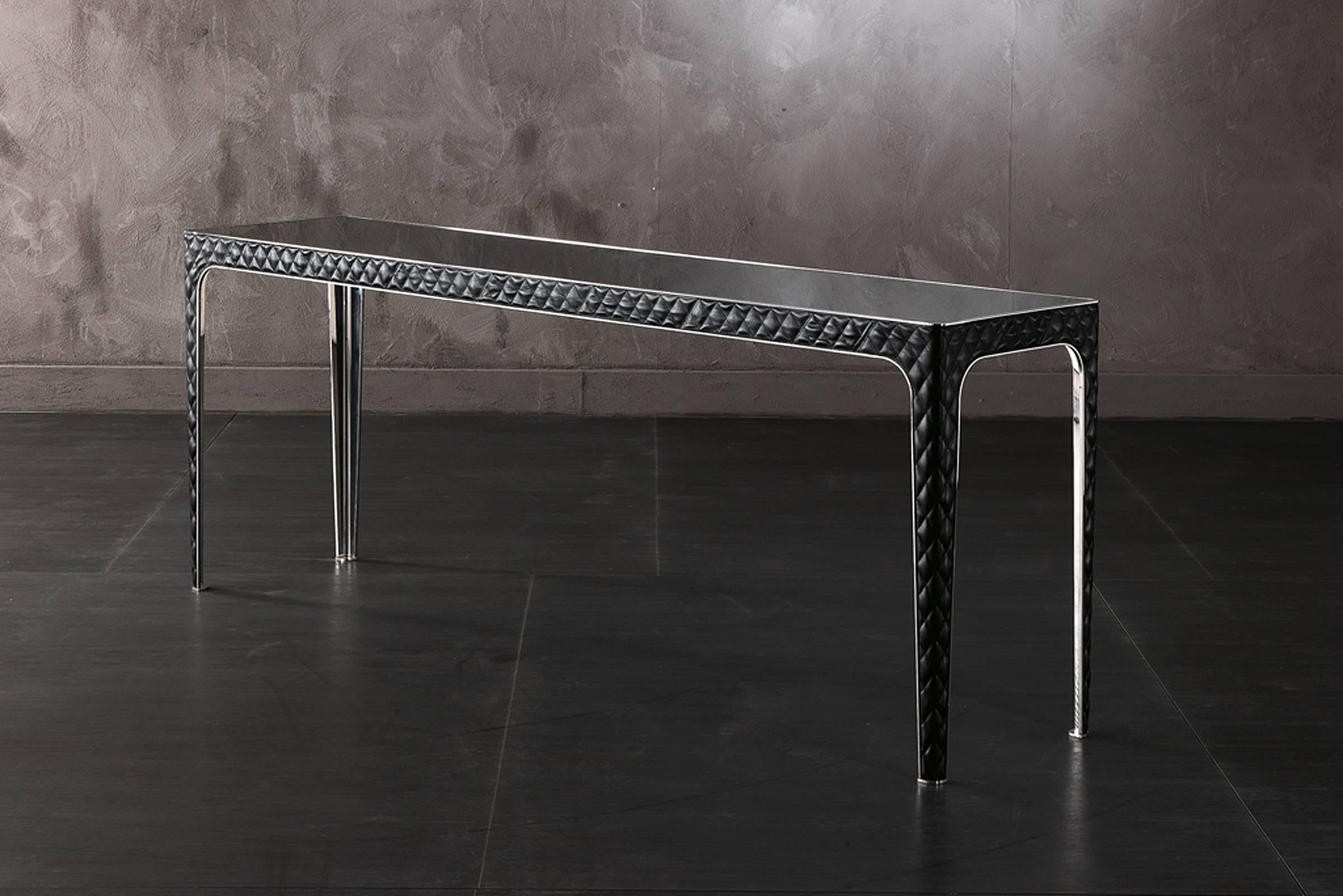 Console 150-Shadow made with 
legs structure in steel and leather Cat. C.
Marble-top
Console available: 
Top in glass; Leather cat. B or C
Structure in bronze
Dimensions: L 201.4 x W 48.4 x H 76.3cm.
