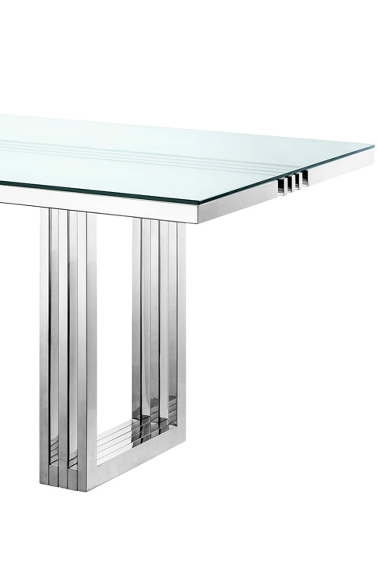 Dining table Giuseppe with polished stainless steel base,
clear glass top. 