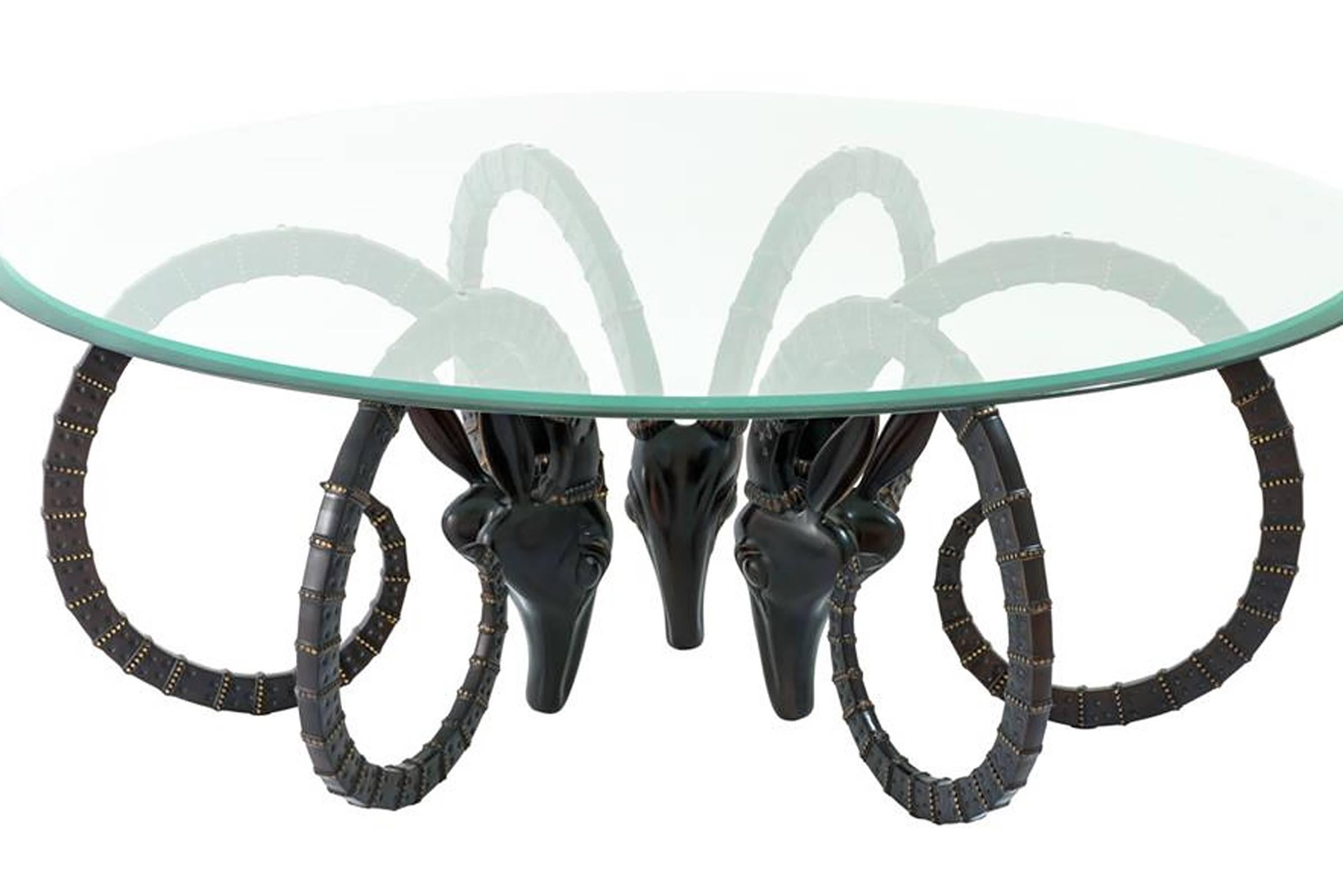 Coffee table Calabra in bronze highlight finish
with bevelled clear glass top.
