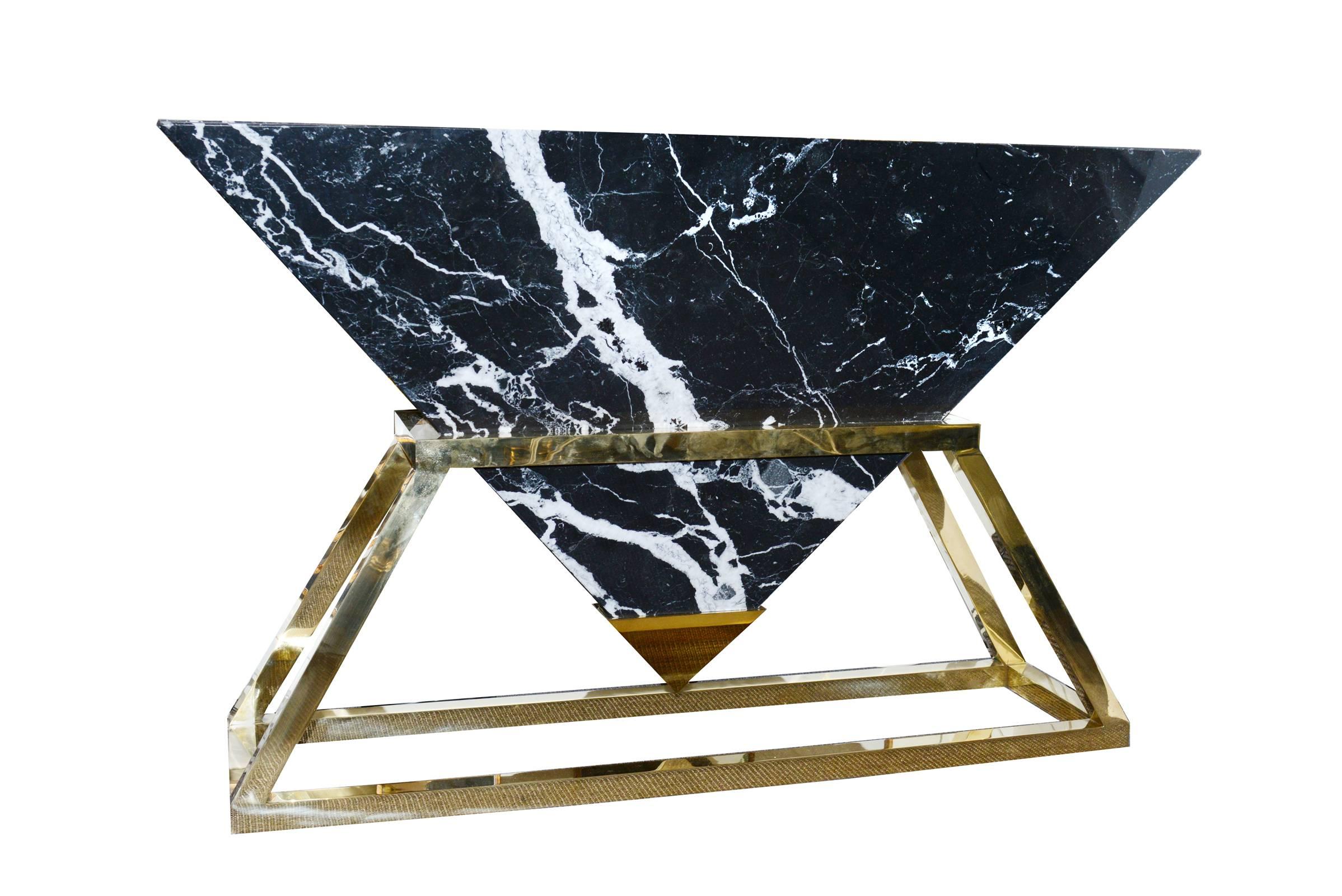 Console table Keops with pyramidal Dulac marble top
from Spain. Exceptionnal veining cut handcrafted. On
an original polished brass base. Spike at the end of the
marble-top is an alloy of bronze and aluminium technically
called Cupro Alu.