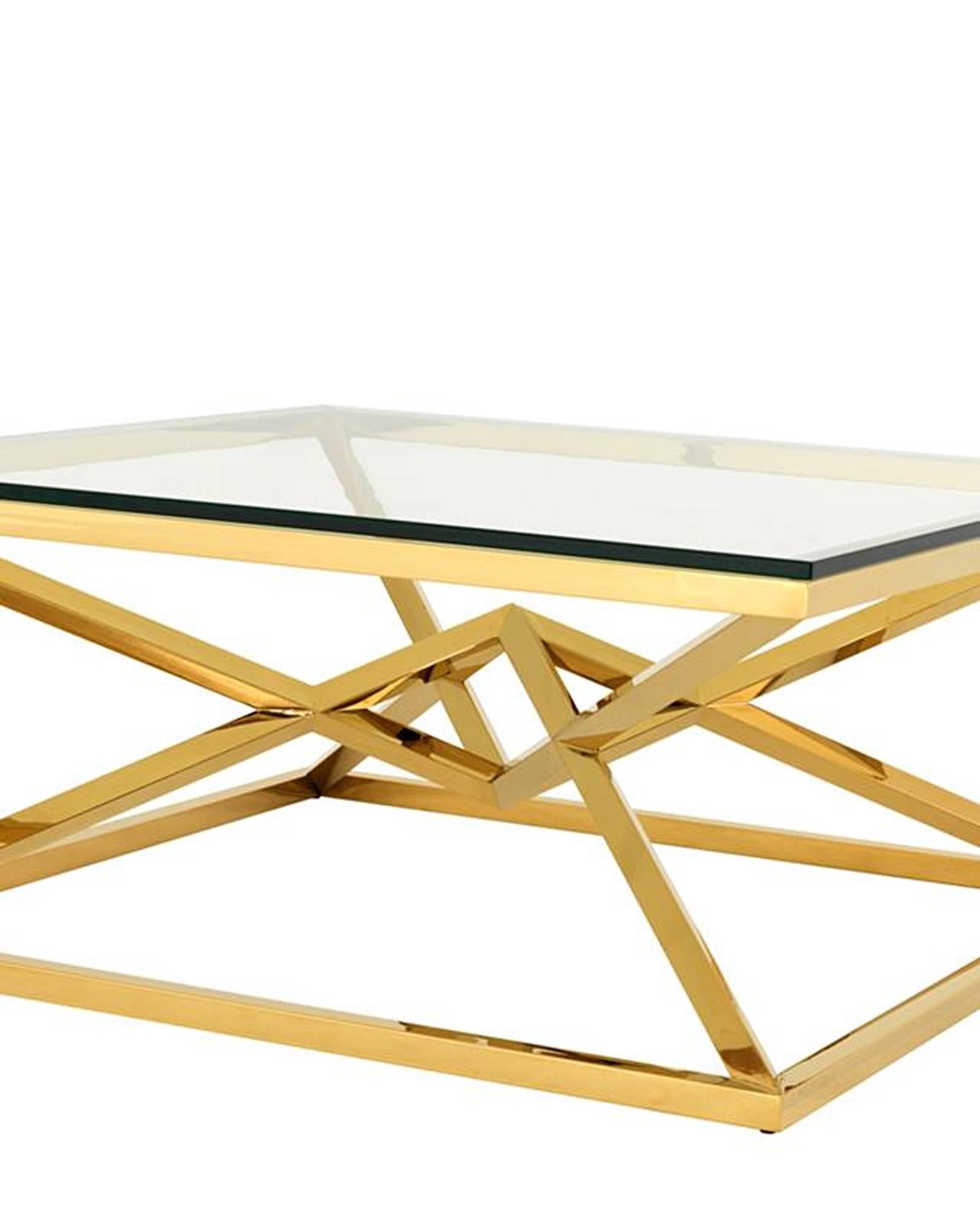 Coffee table Equis with gold finish structure
and clear glass top. Available in polished
stainless steel or bronze finish.
 