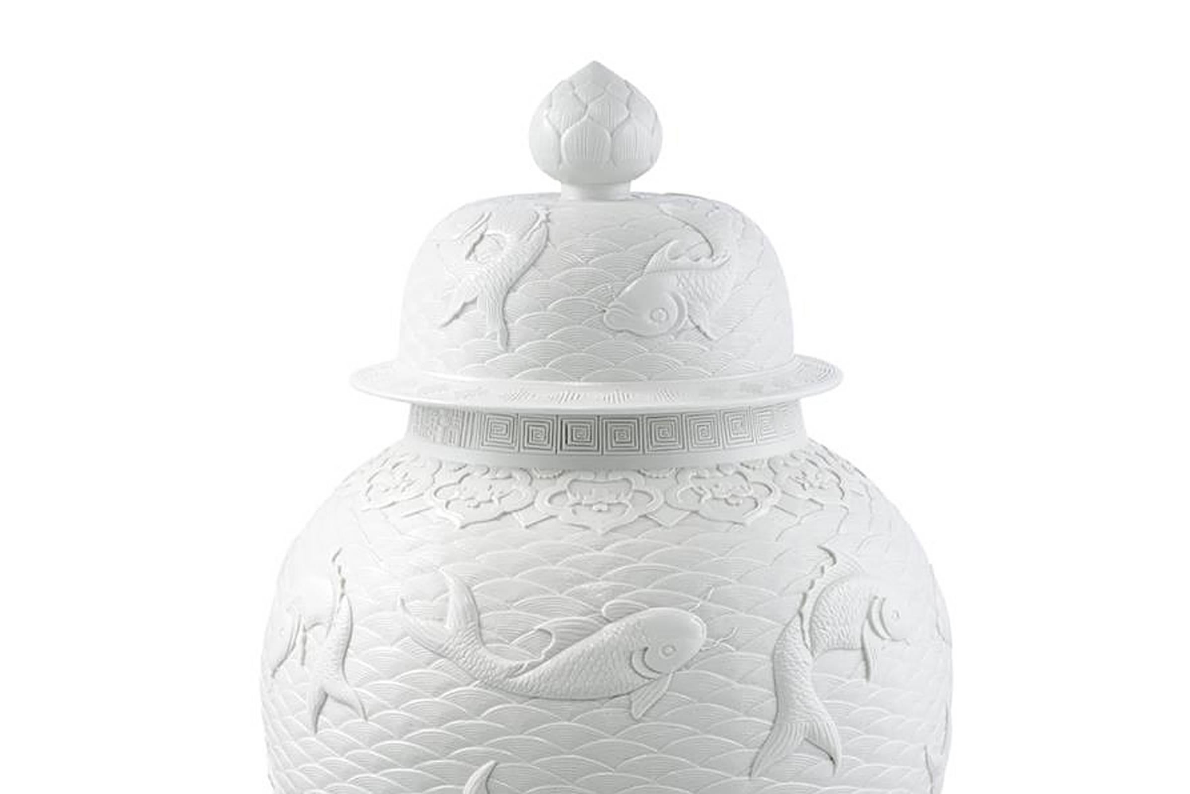 Vase Karps in white relief ceramic with
Japanese fishes and graphical details.

