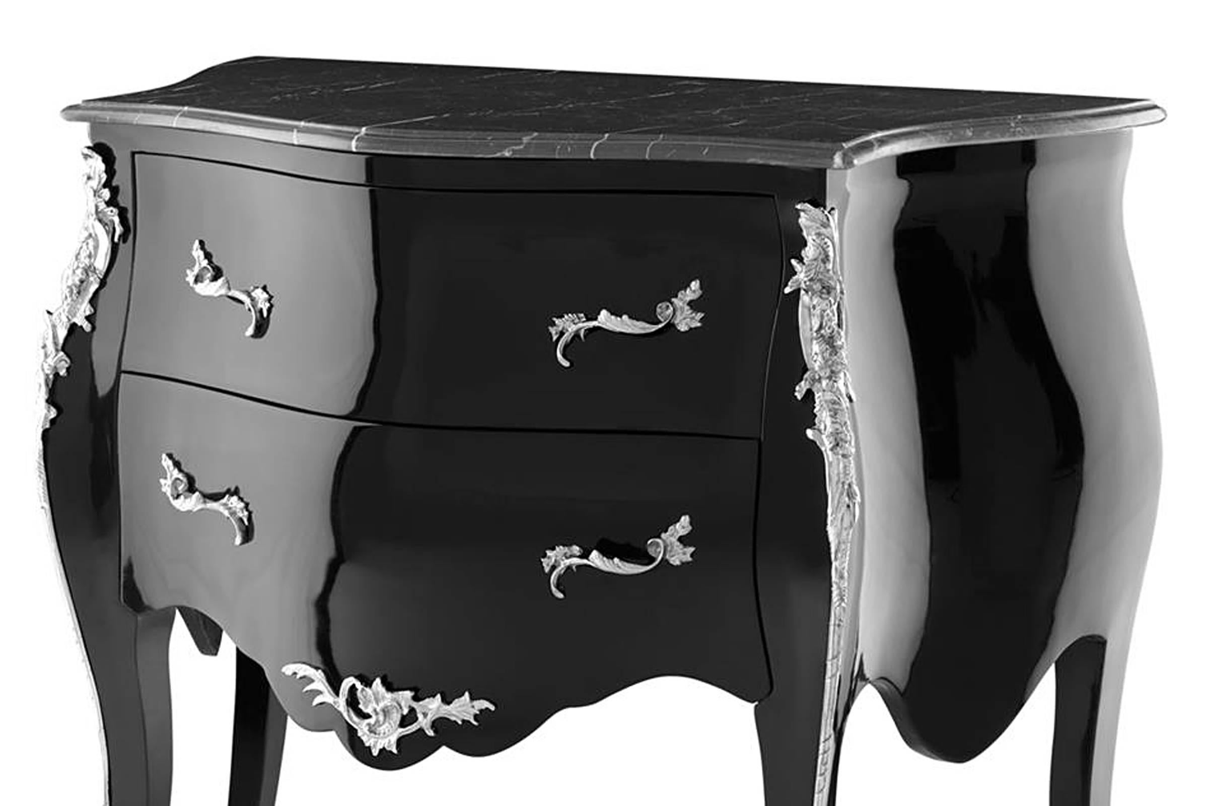Chest Loire in black lacquered 
pine wood, nickel details finish and
black marble top. Available in side 
table. 