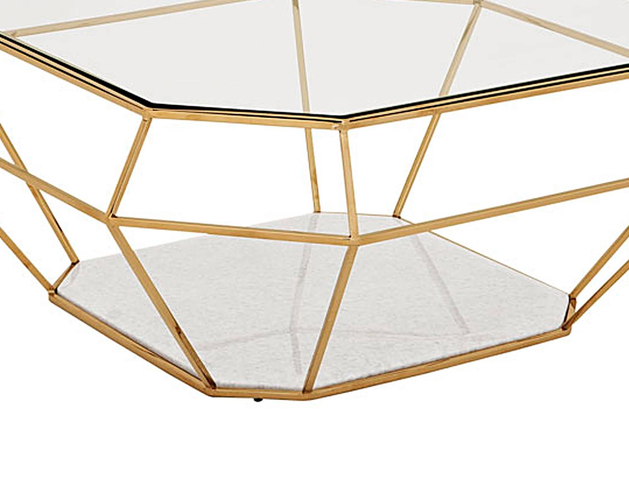 Diamond coffee table with stainless steel structure
in gold finish. Clear glass top and white marble base.
Also available in polished stainless steel finish.
