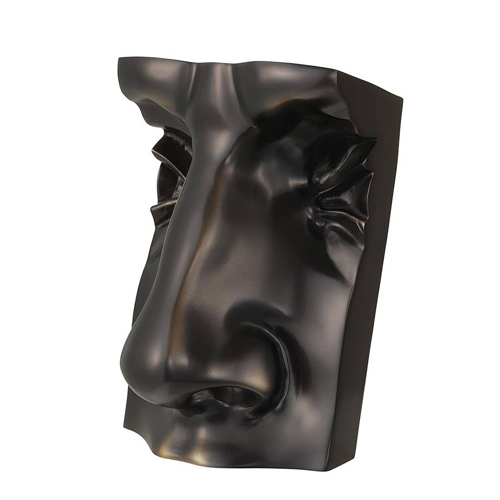 Sculpture David face in antique bronze finish.
.