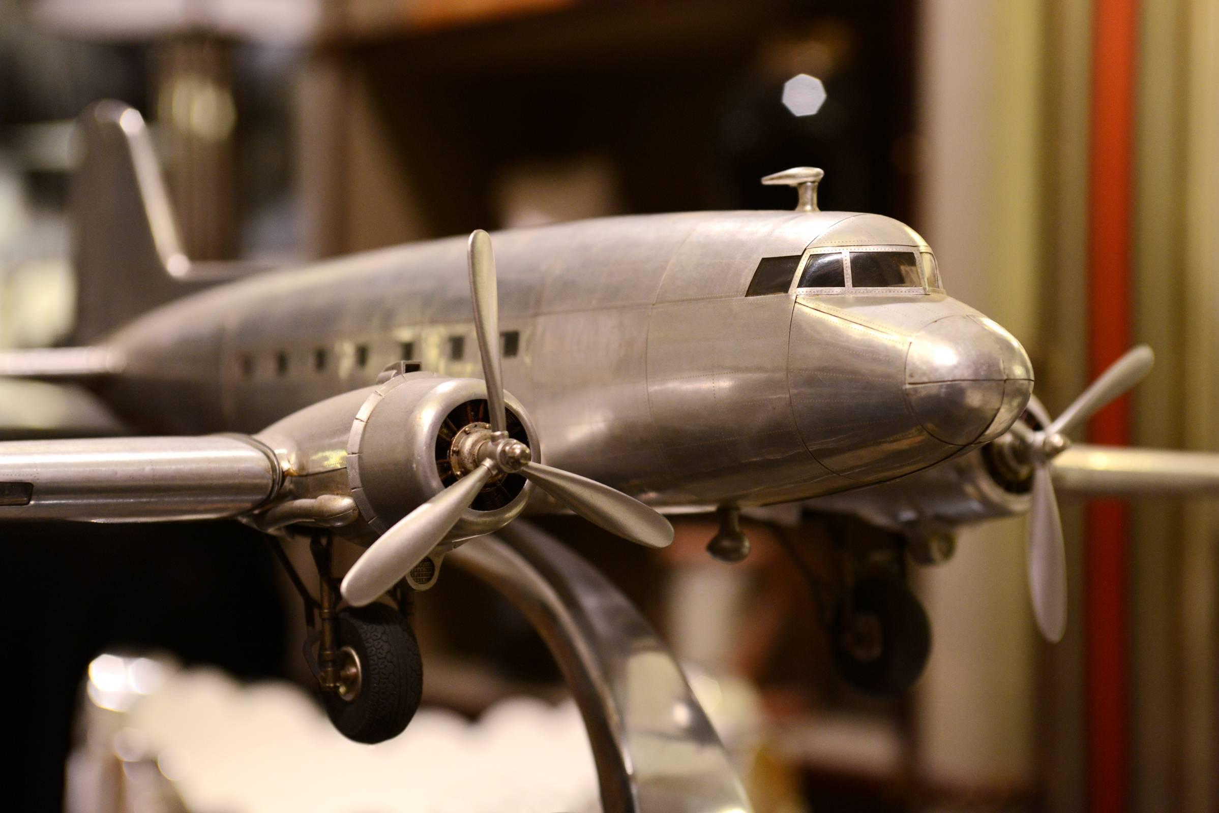 DC-3, Dakota aircraft reduced model scale model.
Handcrafted in aluminium foil,
with engraved metal rivets, 1936.
.