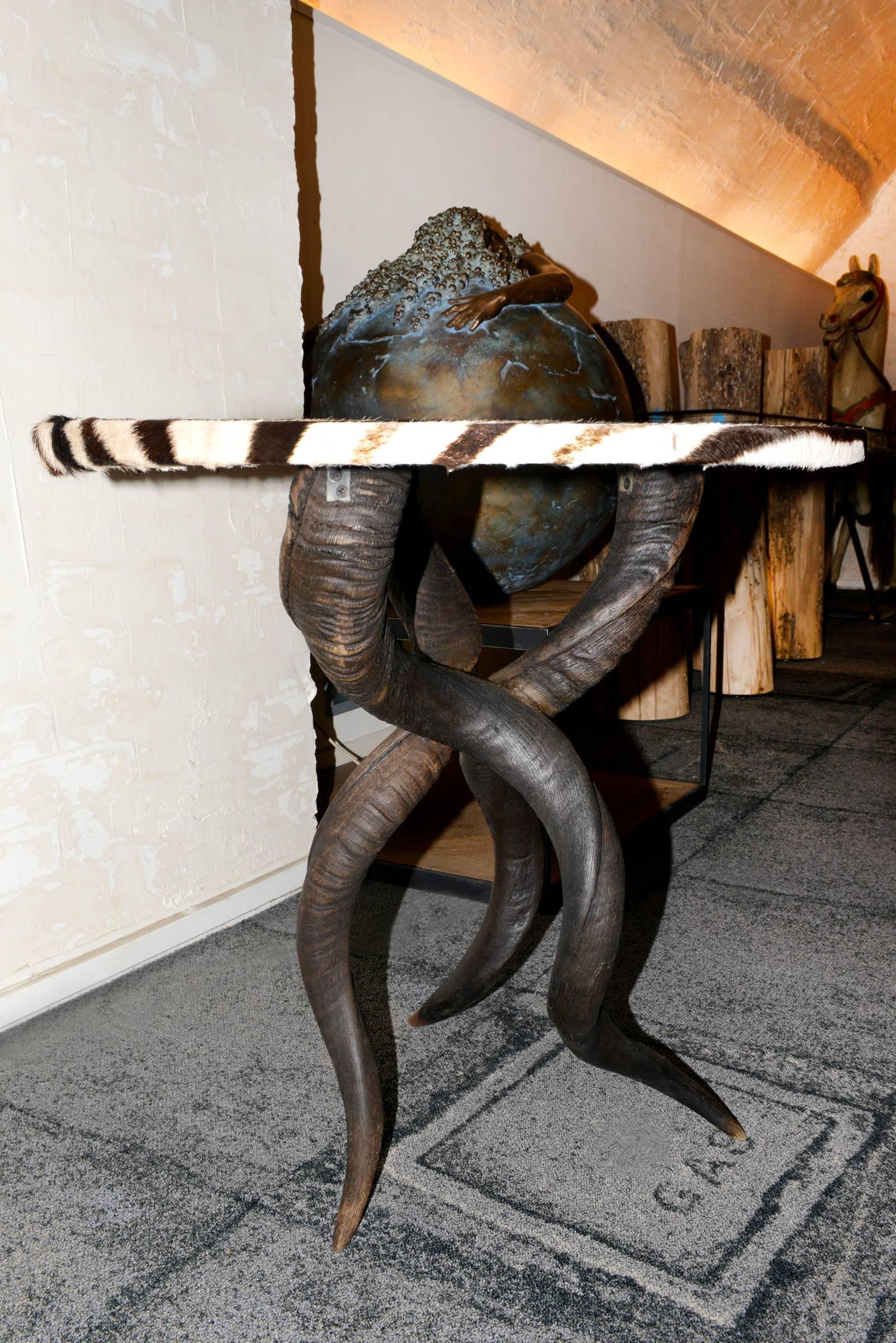 Side table zebra with real zebra skin as top
and with base made with reak kudu horns.
Exceptional handcrafted piece.
