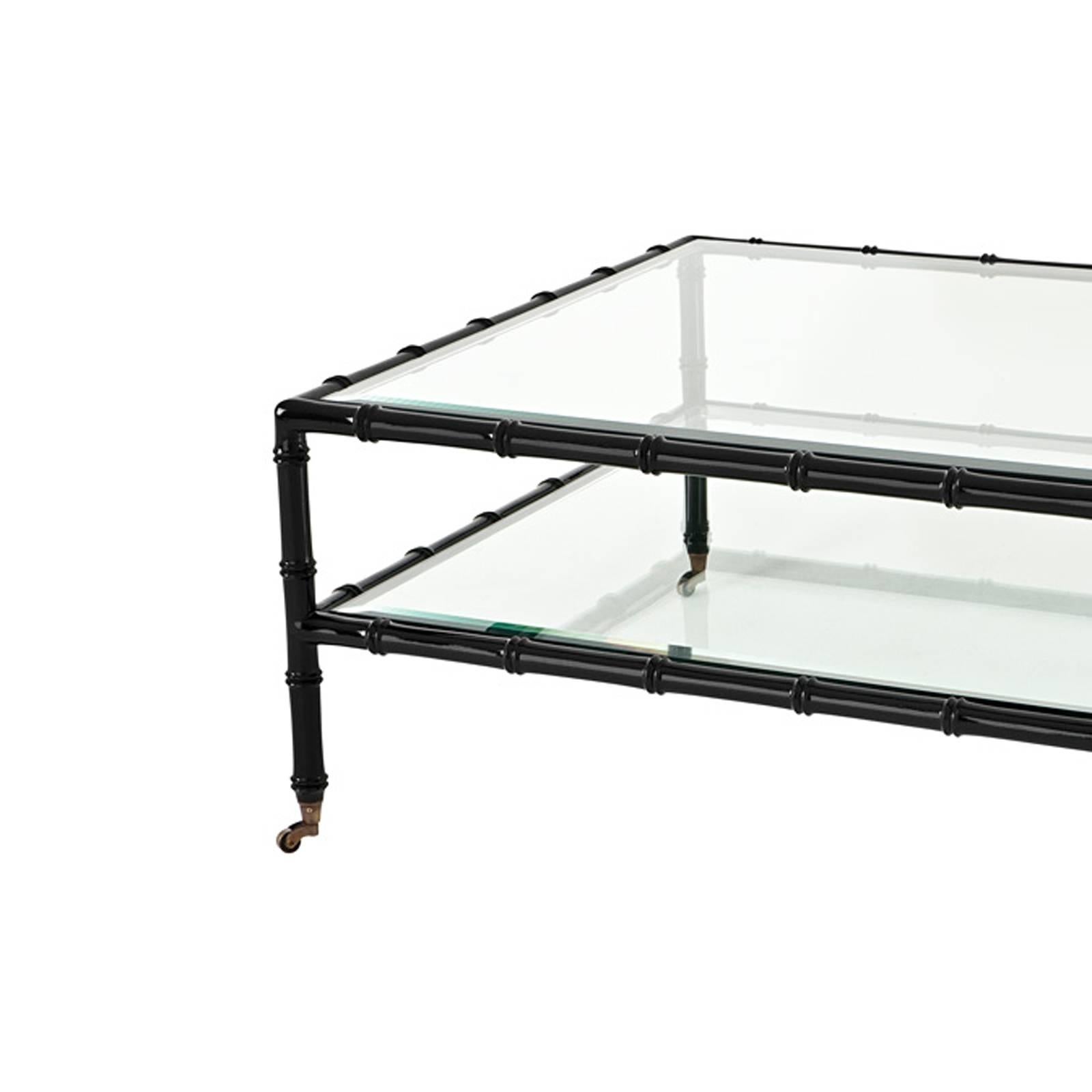 Coffee table bamboo in black finish teak wood.
On trolleys. Bevelled clear glass top.

