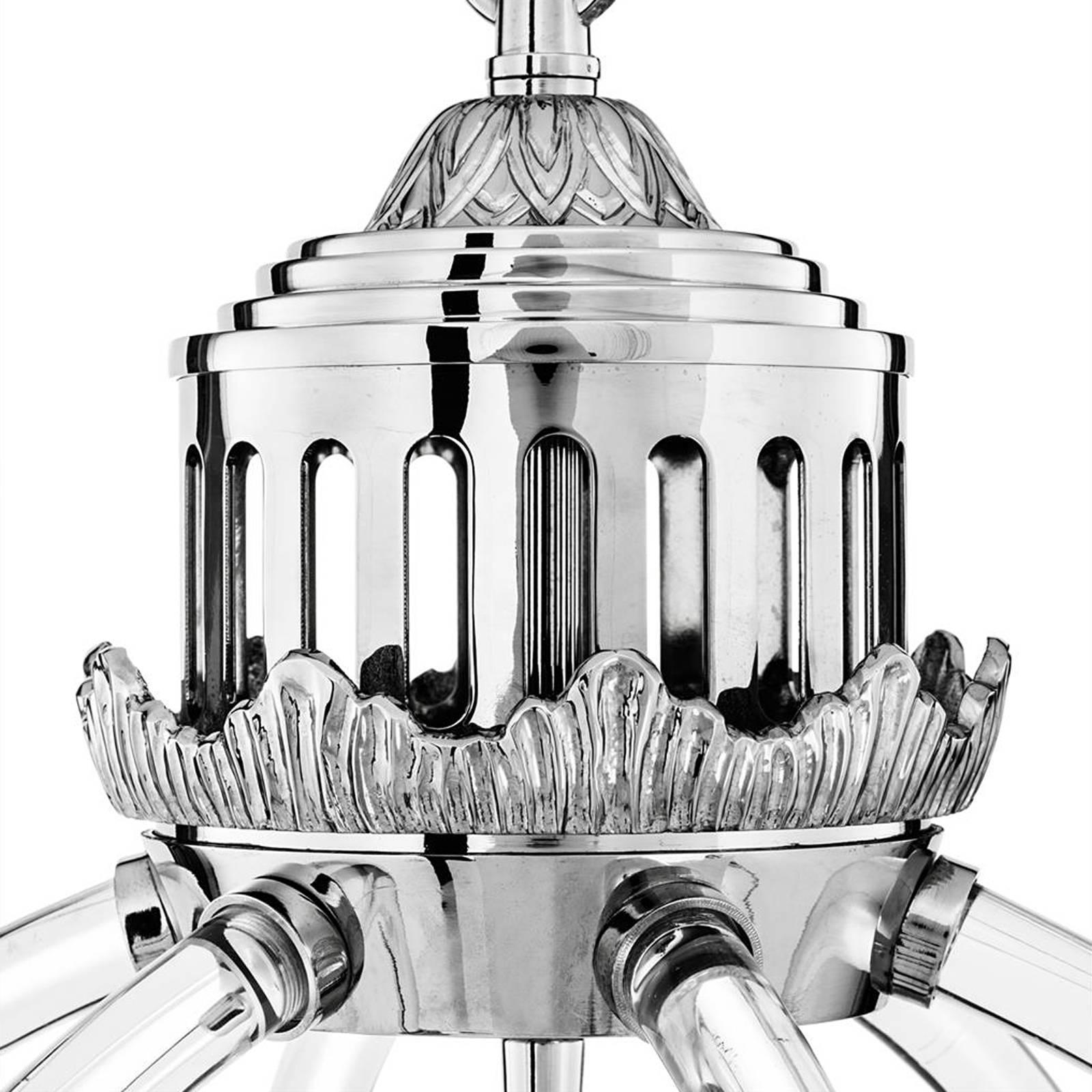 Chandelier Empiro in clear acrylic glass
and structure in polished nickel finish.
four bulbs lamp holder type E14, max 40 Watt.
Adjustable chain: 150cm.
Bulbs not included.
