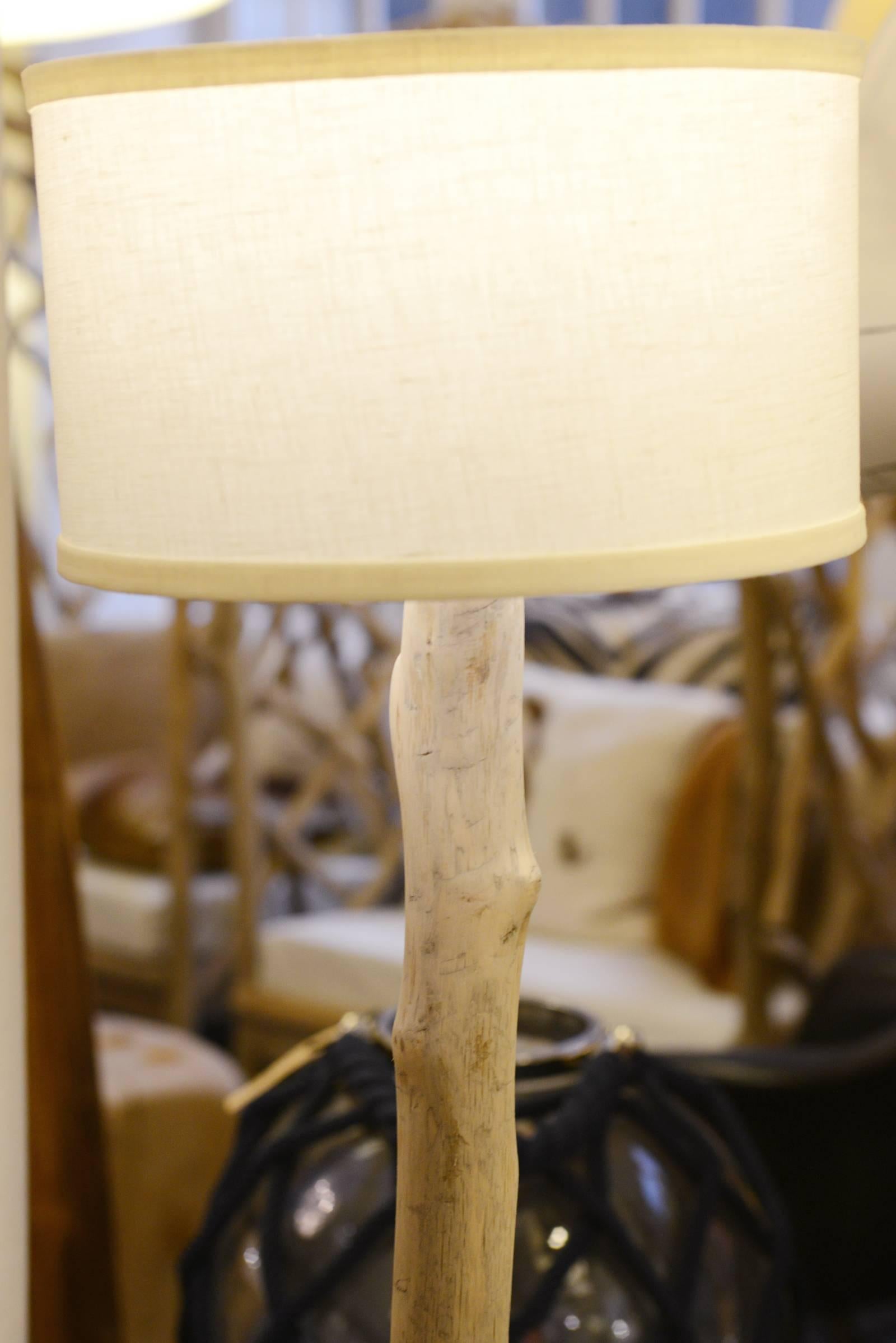 Set of three Driftwood floor lamps in natural
driftwood on white inox base.
H 107cm, H 144cm and H 182cm. 
Set of three, price: 3290,00€

