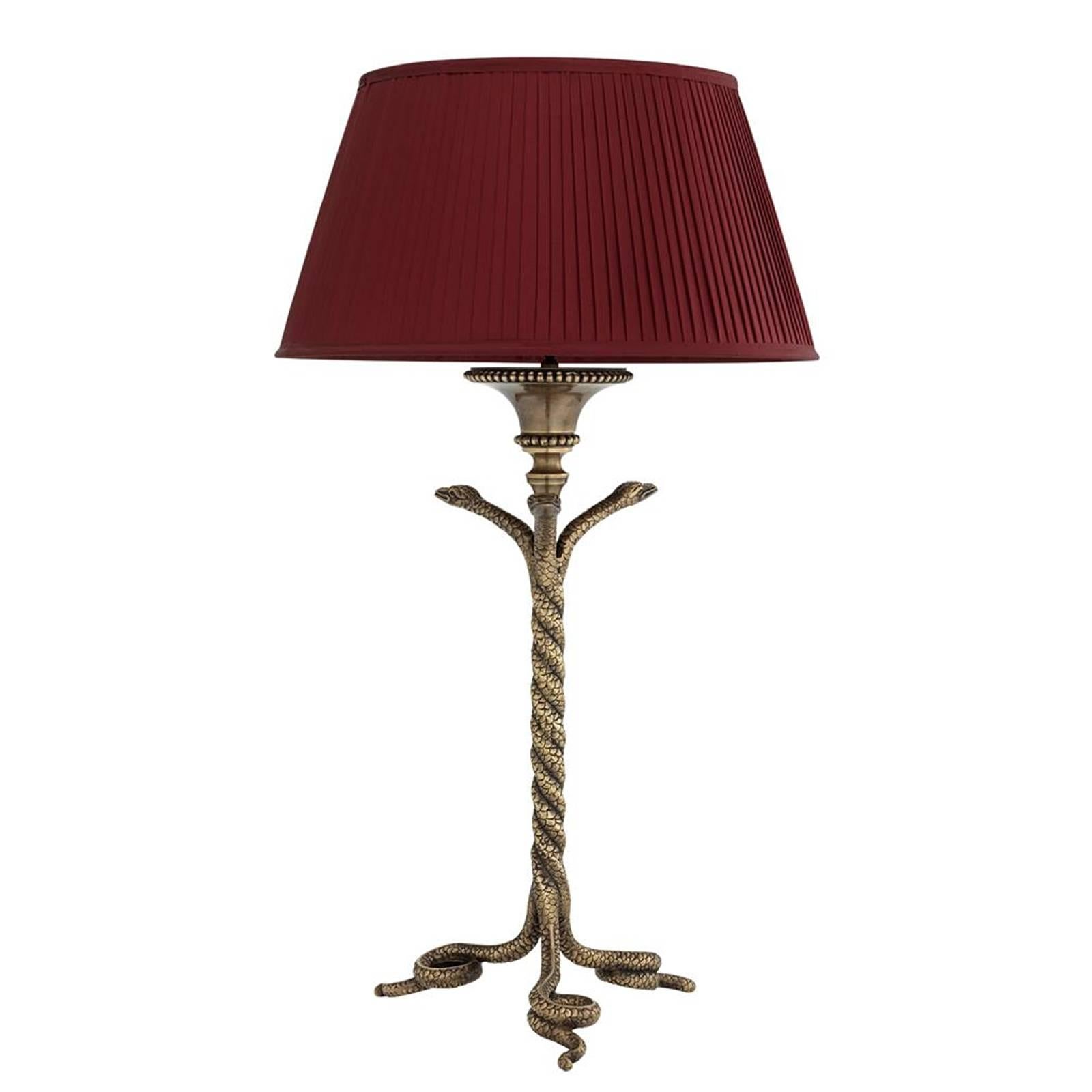 Table lamp vipers in vintage brass finish. 
On black granite base. One bulb lamp holder
type E27, max 40 watt. With red pleated 
shade included. Bulb not included.
Also available in floor lamp.
Also available with black pleated shade.
