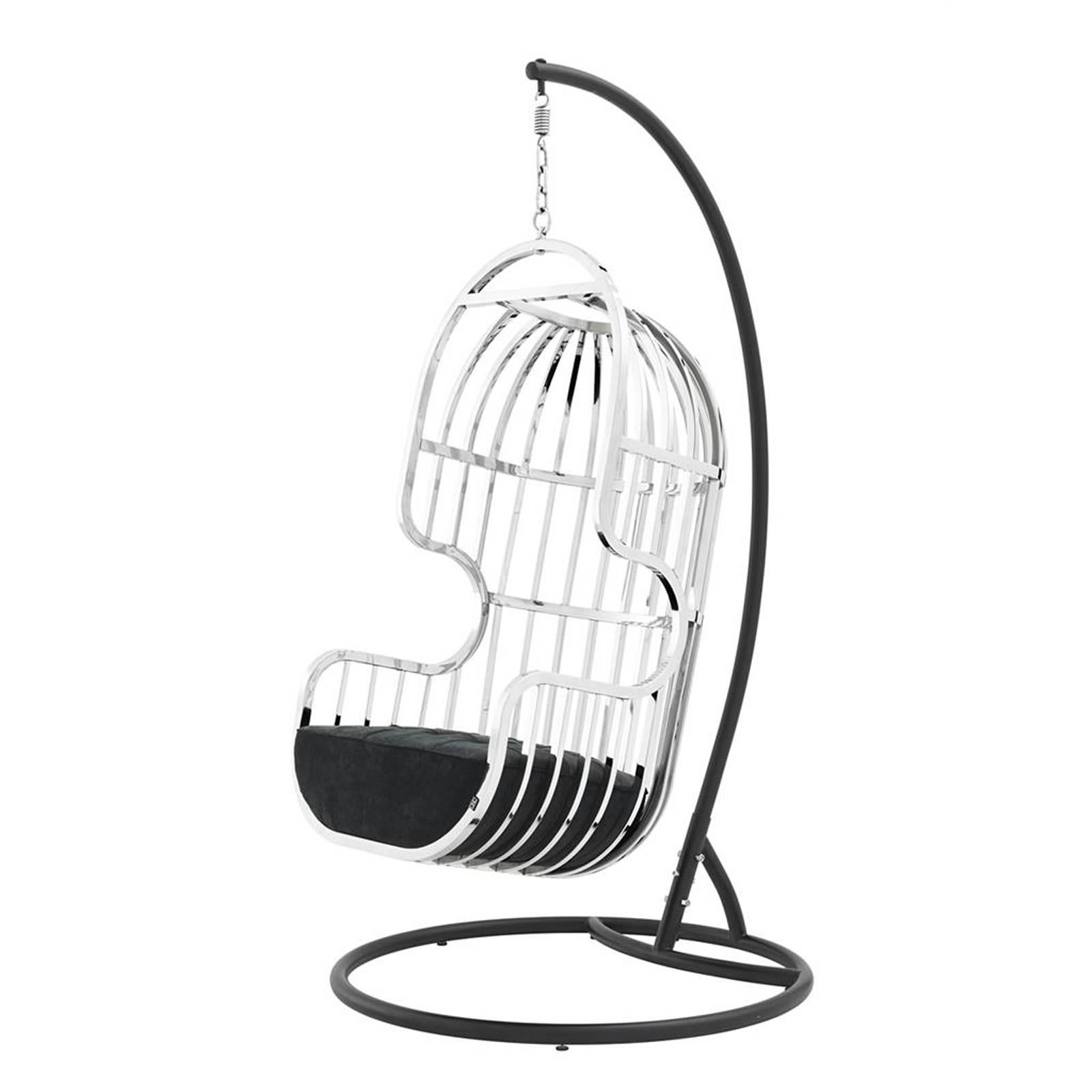 Armchair swivel cage in polished stainless steel
with black velvet steel. On black finish stand.
