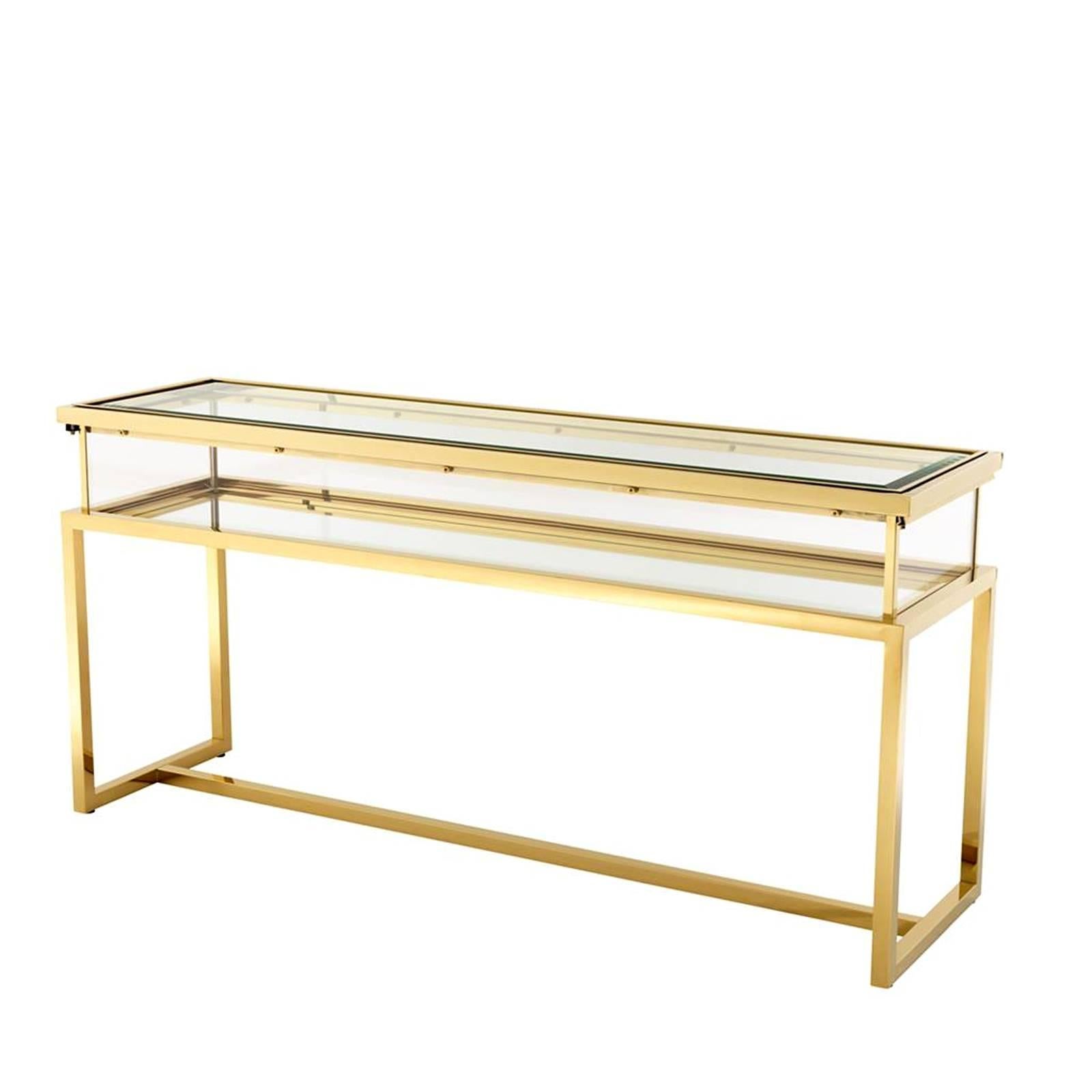 Console table with gold finish structure, clear glass 
and mirror glass. Sliding top. Also available in polished 
stainless steel.
