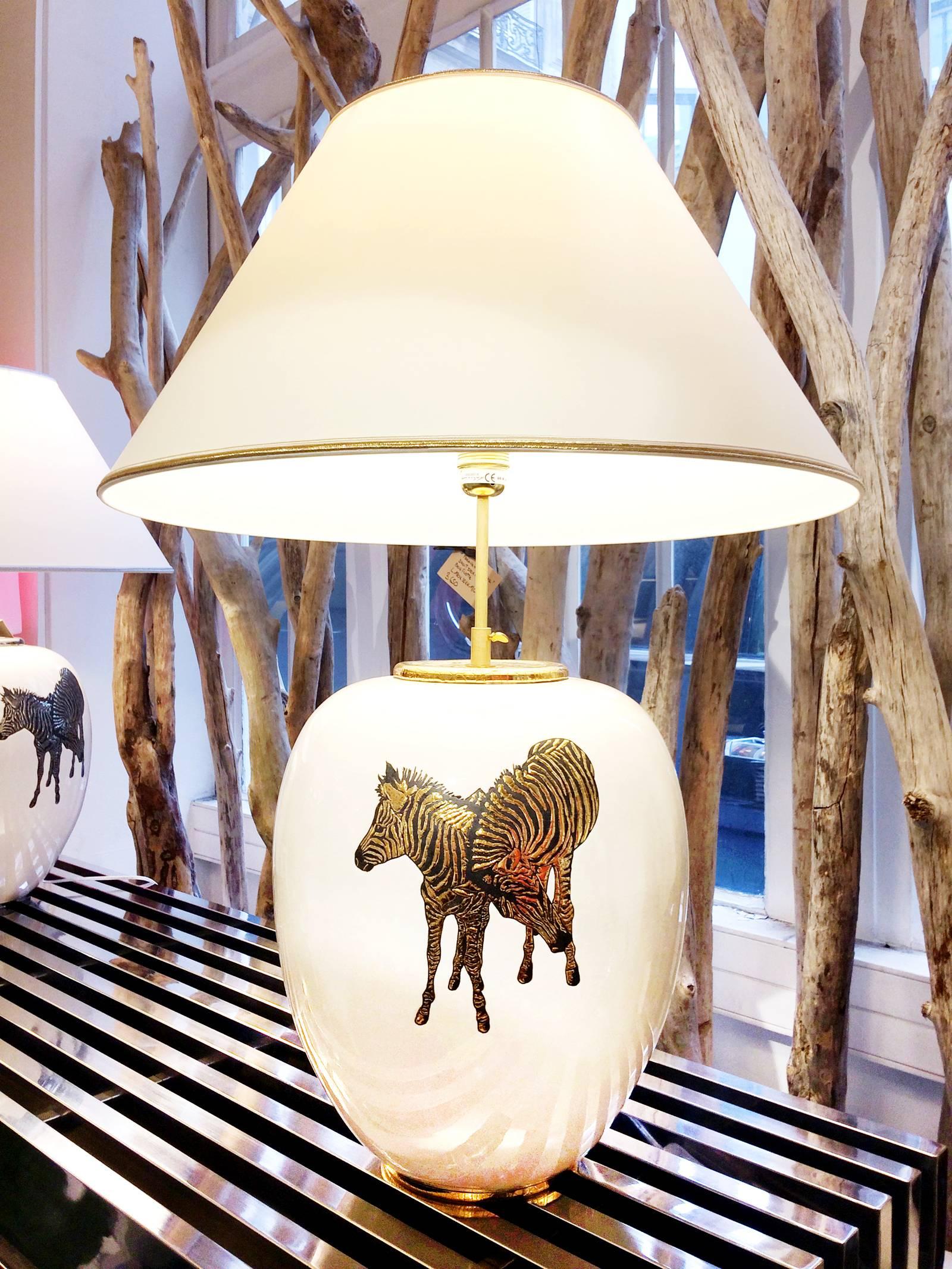 Table lamp zebra in Emaux de Longwy,
earthenware from France. with four golded zebra,
Exceptional piece. Available with four silvered zebra.
Measures: Shade: Diameter 56 x H75 cm.
Base: Diameter 30 x H38 cm.

  