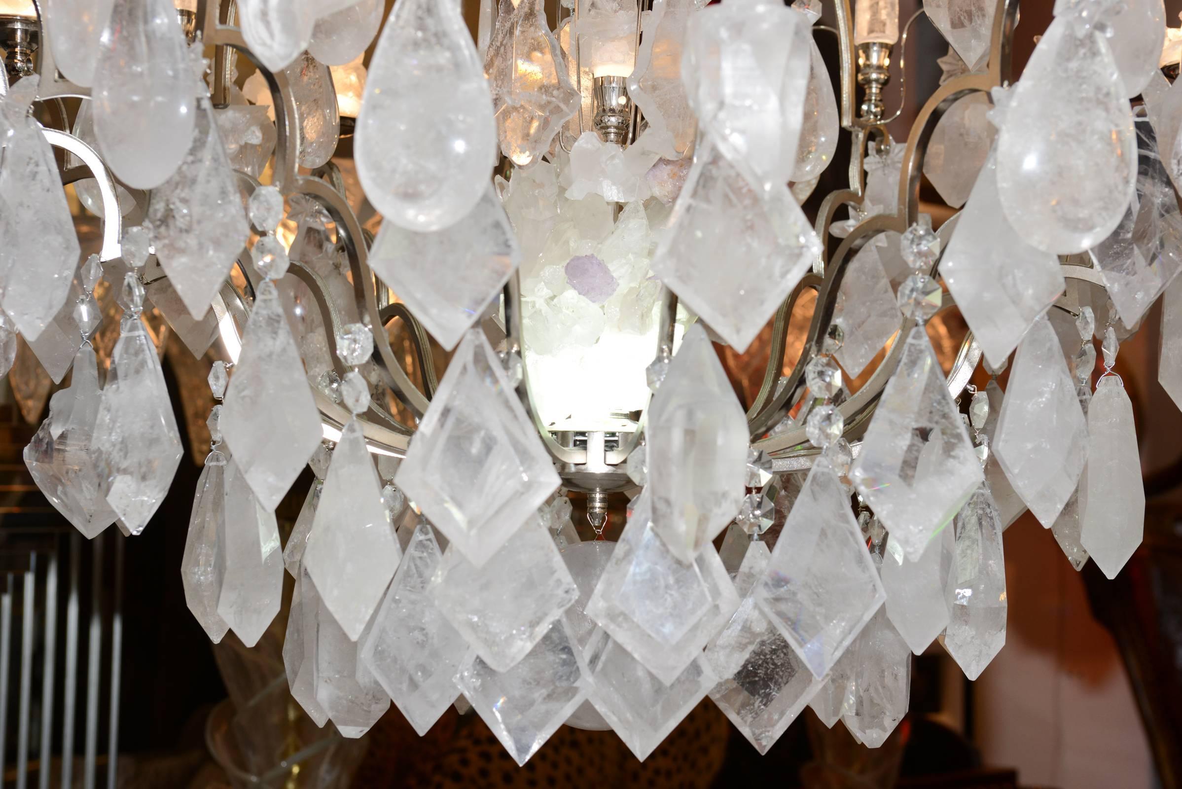 Chandelier pure crystal rock, a masterpiece in rock crystal, made in 2017.
Re-visited 18th century chandelier composed of classically cut pendants, 
half-cut natural crystals and natural druces. It brings together the 
wonders of art crafts and