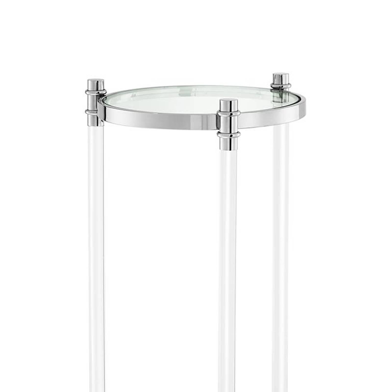 Colomn Tertio with polished stainless steel 
structure, clear glass top and clear acrylic feet.
Also available in cabinet, coffee table and side table.
