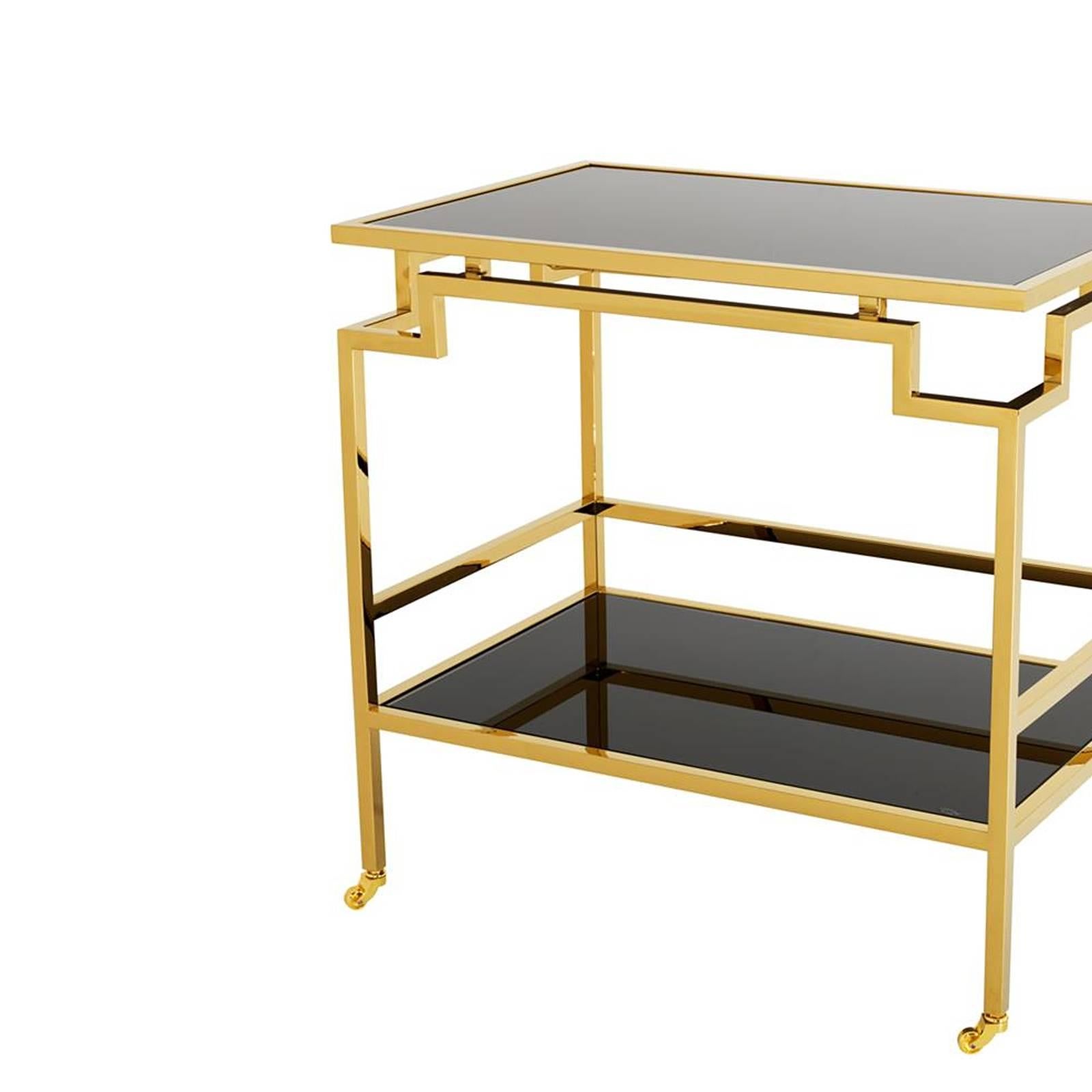 Trolley angles with gold finish structure with
two smoked glass top.
Also available in polished stainless steel with
two smoked glass top.
 