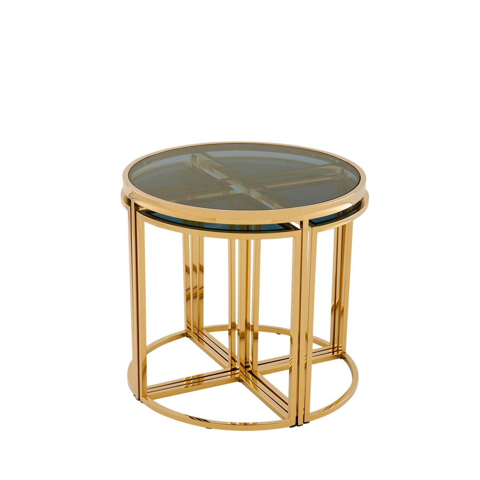 Side table four pieces with gold finish structure
and smoked glass top. One side table included four small
side tables. Also available in polished stainless steel 
and smoked glass top.
