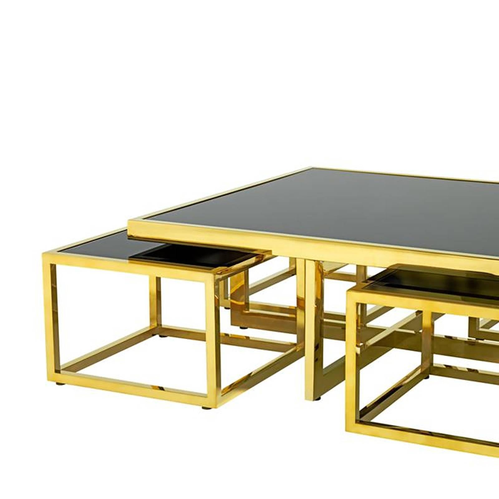 Coffee table four pieces with gold finish structure
and smoked tempered black glass tops. Price: 4700,00 €
one square coffee table L 100 x D 100 x H 40 cm, included
four square side table L 48 x D 48 x H 33 cm.
Also available in polished