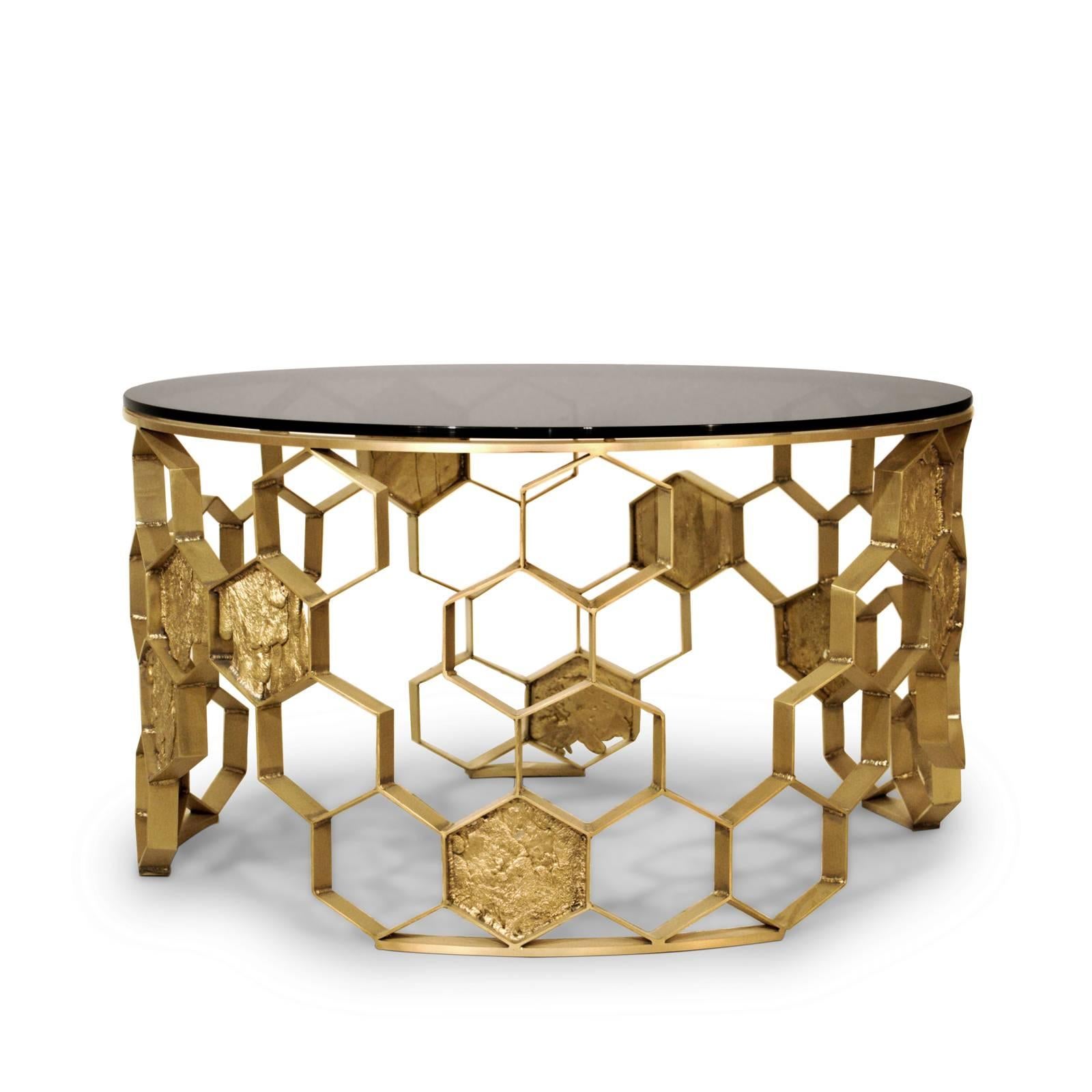 Coffee table bee nest with structure handcrafted 
in matte brass finish. With a smoked glass top.
