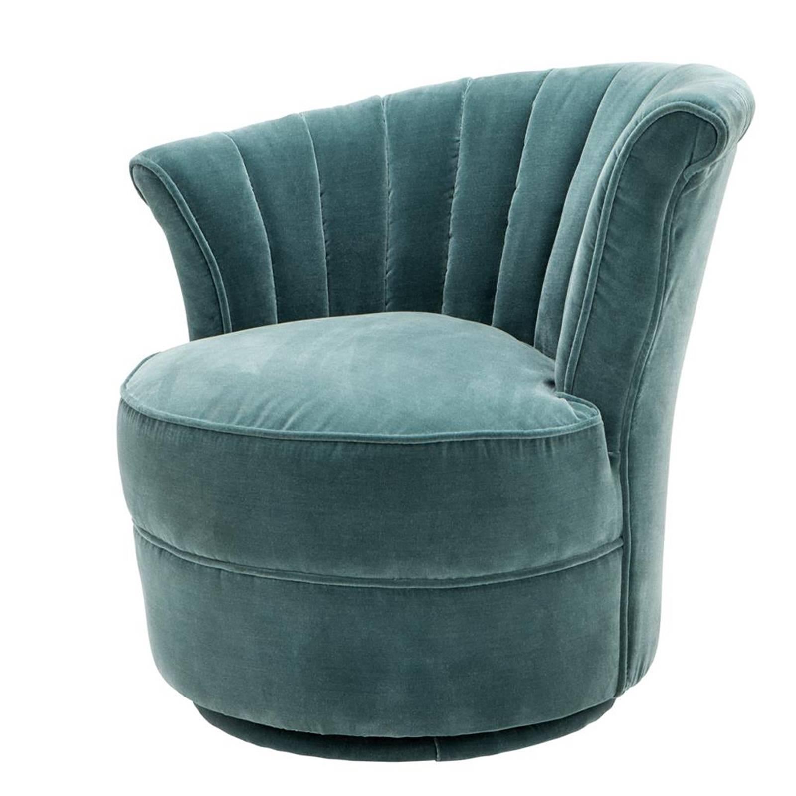 Wing chair left with turquoise velvet fabric
with fire retardant treatment. Structure in 
solid wood. On swivel base.
Also available in black velvet fabric.
Also available in chair right.

 