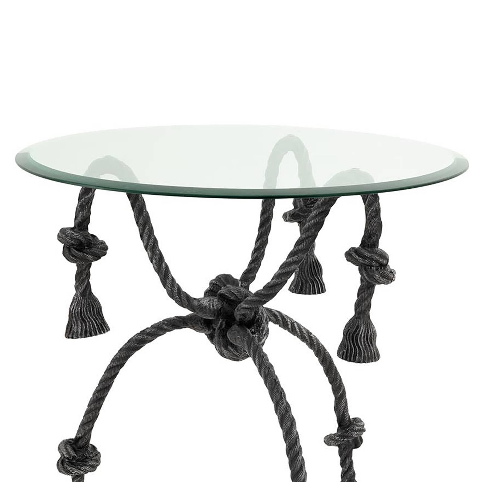 Side table intertwine with base in gunmetal
finish with bevelled clear glass top.
