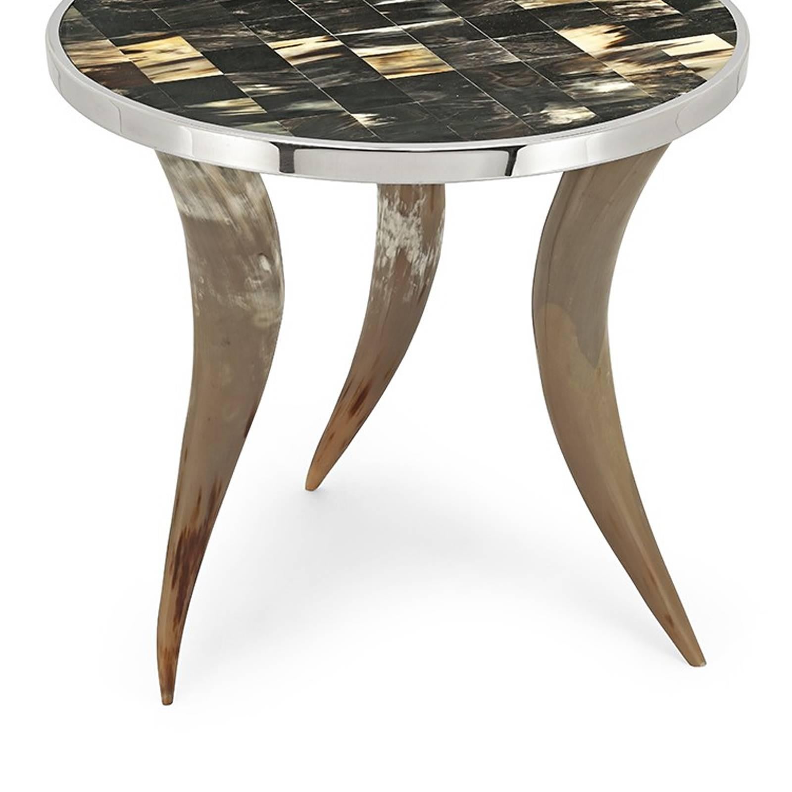 Side tables bones and horns “L” with three horns feet
made with bones. Checkerboard top made with
bones and surrounded with polished stainless steel.
