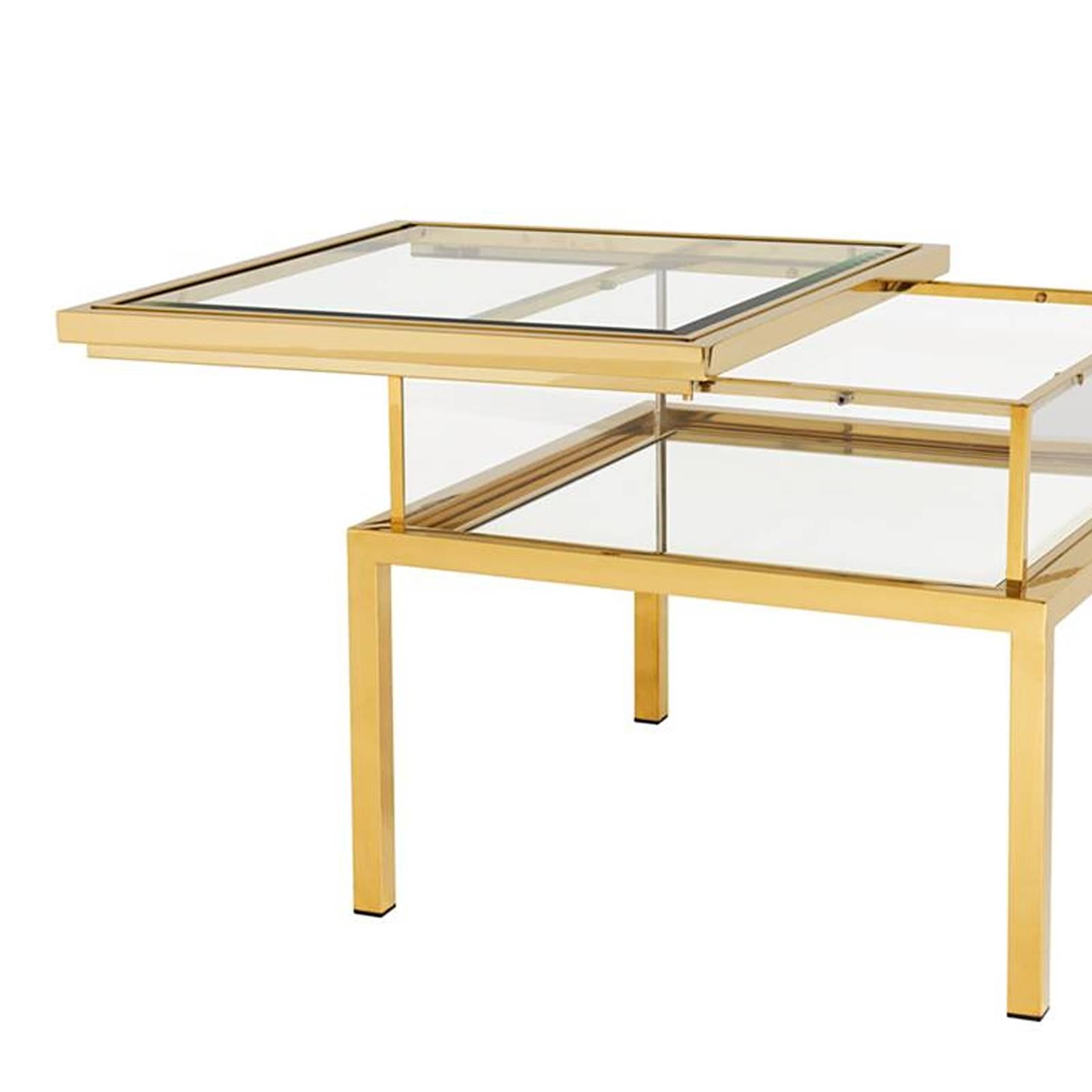 Side table slide in gold finish, clear glass and mirror
Glass sliding top. Available in polished stainless steel
or in bronze finish. Also available in coffe table, square
coffee table or in console table slide.
