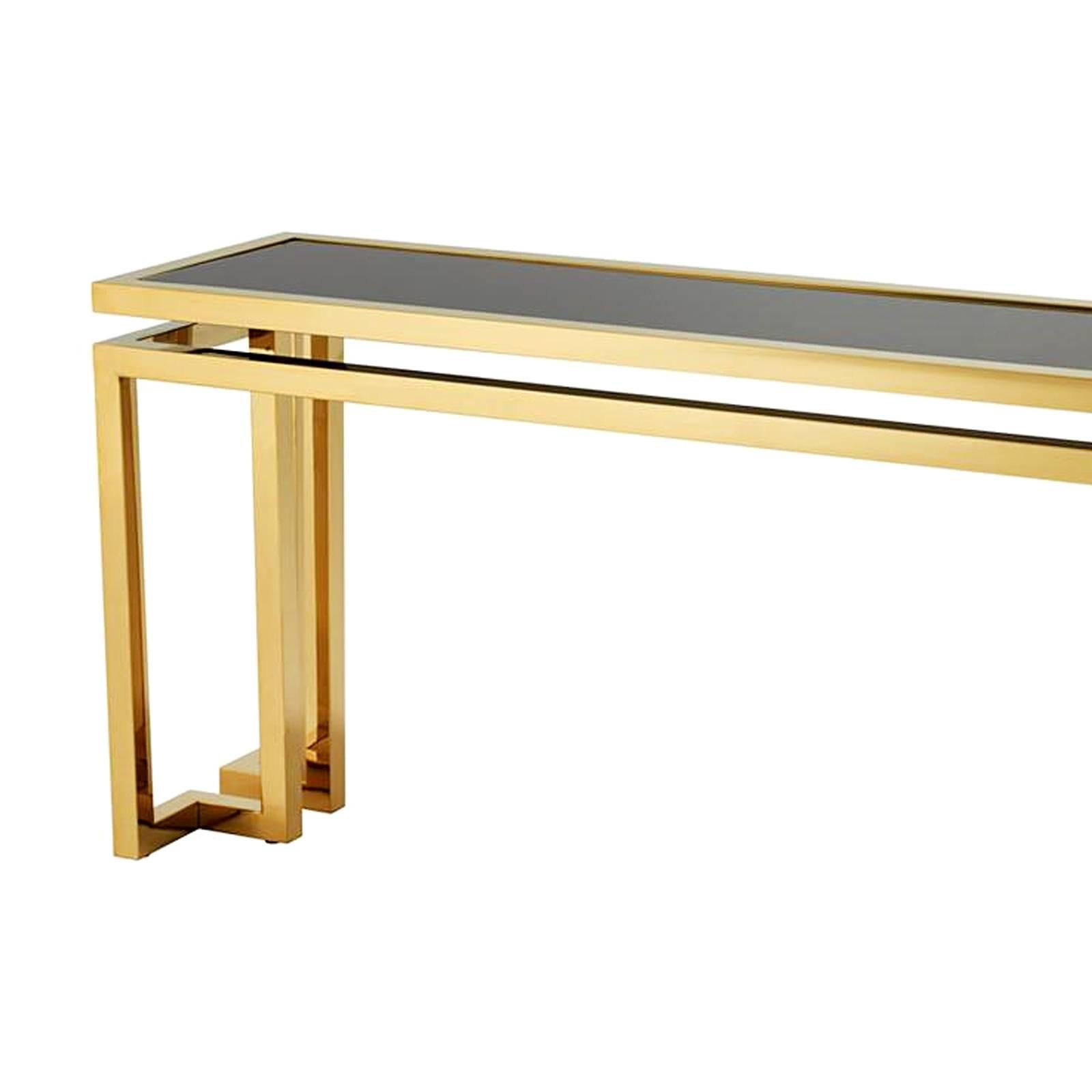 Console table angles with structure in gold finish
with black glass top. Also available with structure in
polished stainless steel with black glass top. Also
available in coffee table angles or side table angles.
