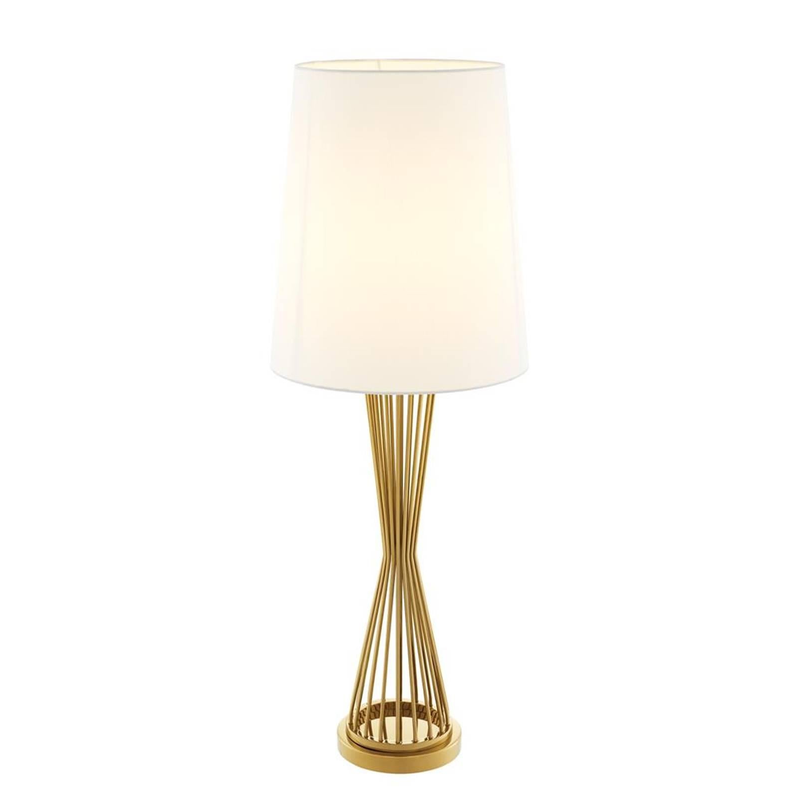 Table lamp Barnet with base in gold finish.
Off-white shade included. One bulb, lamp holder
type E27, max 40 watt. Bulb not included.
Also available in nickel finish.
Also available in floor lamp Barnet.
 